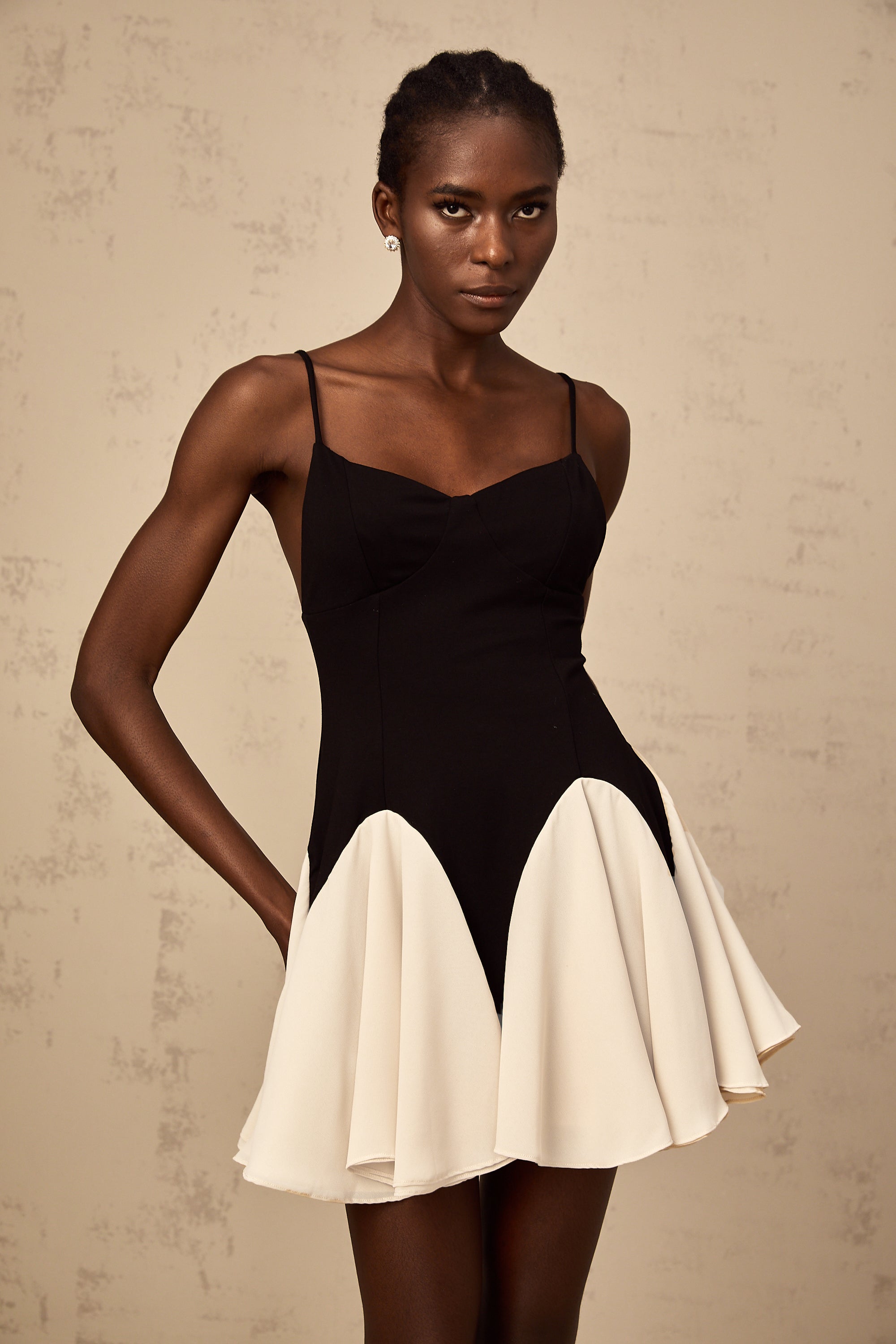 Justine color-blocked godet pleated mini dress