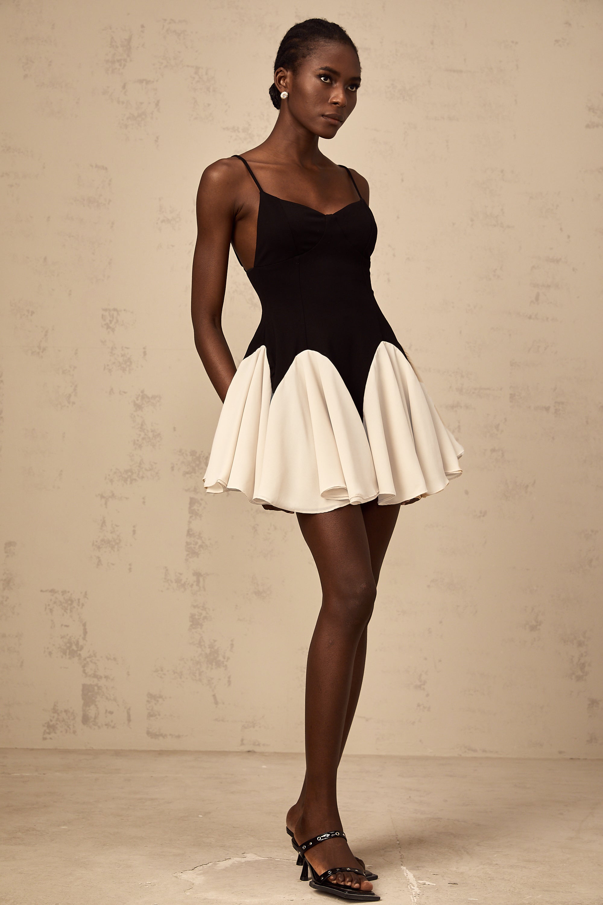 Justine color-blocked godet pleated mini dress