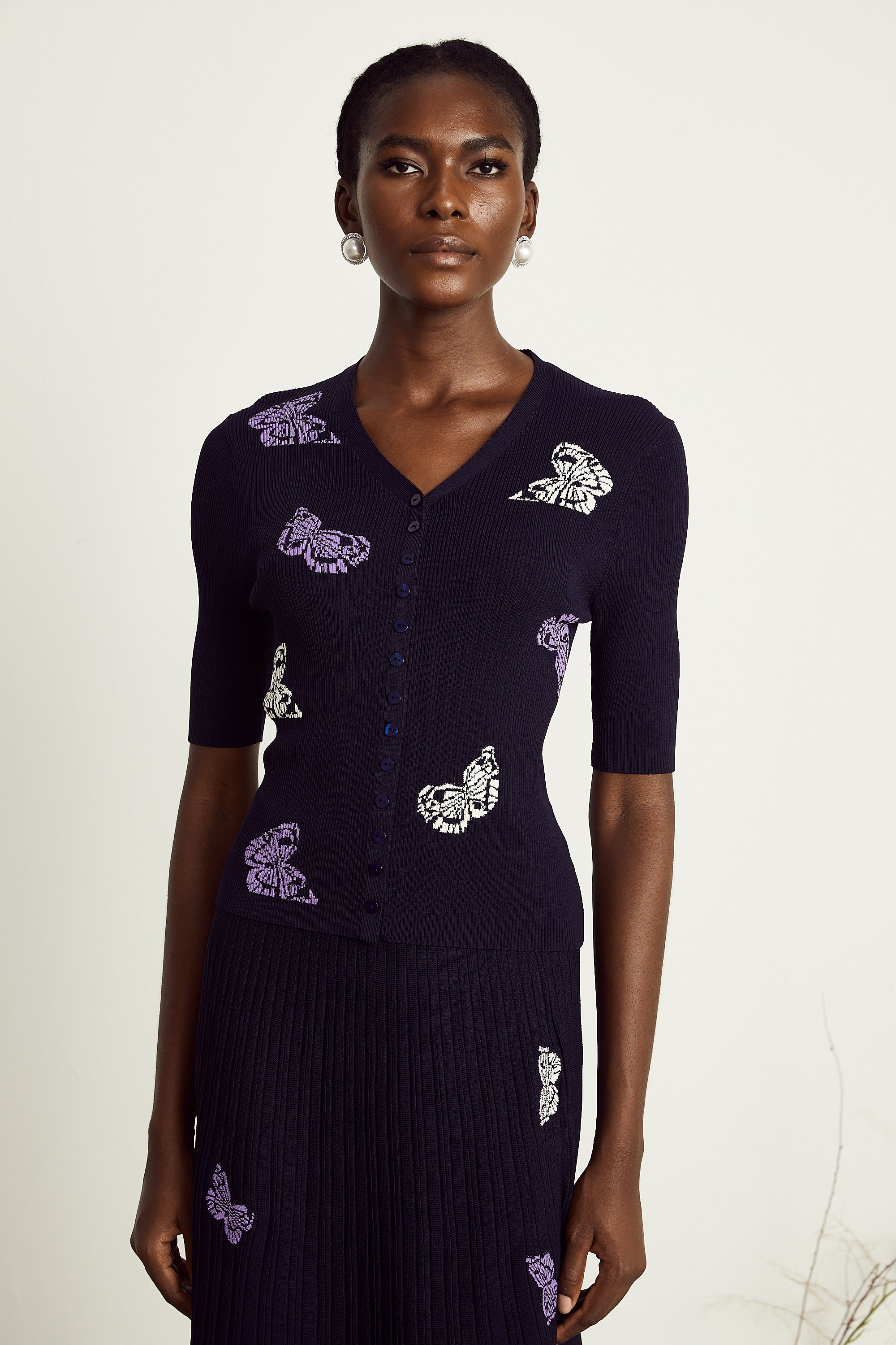 Delphine – Passendes Set aus Oberteil und Rock aus Rippstrick mit Schmetterlingsmotiv