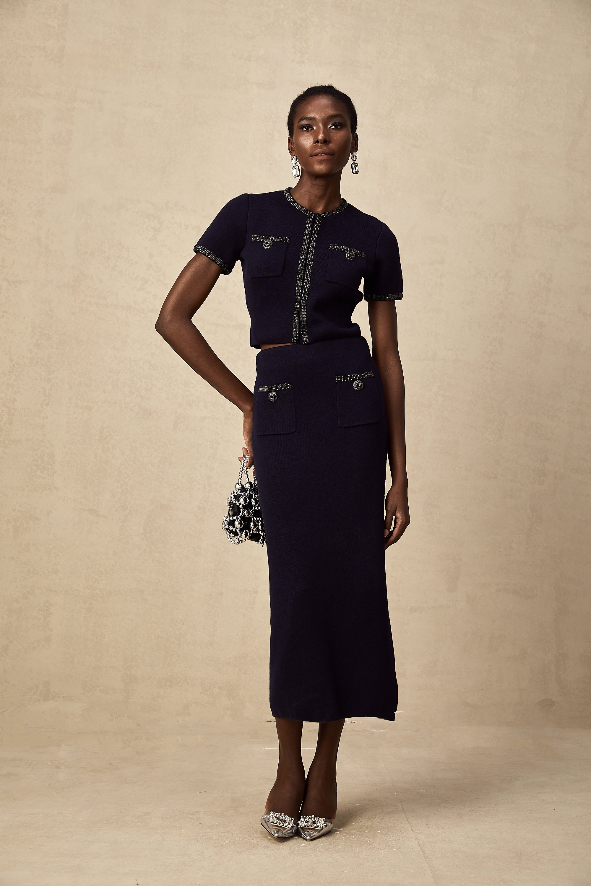 طقم Aïda المزين بقماش محبوك مضلع مكون من بلوزة وتنورة متناسقة