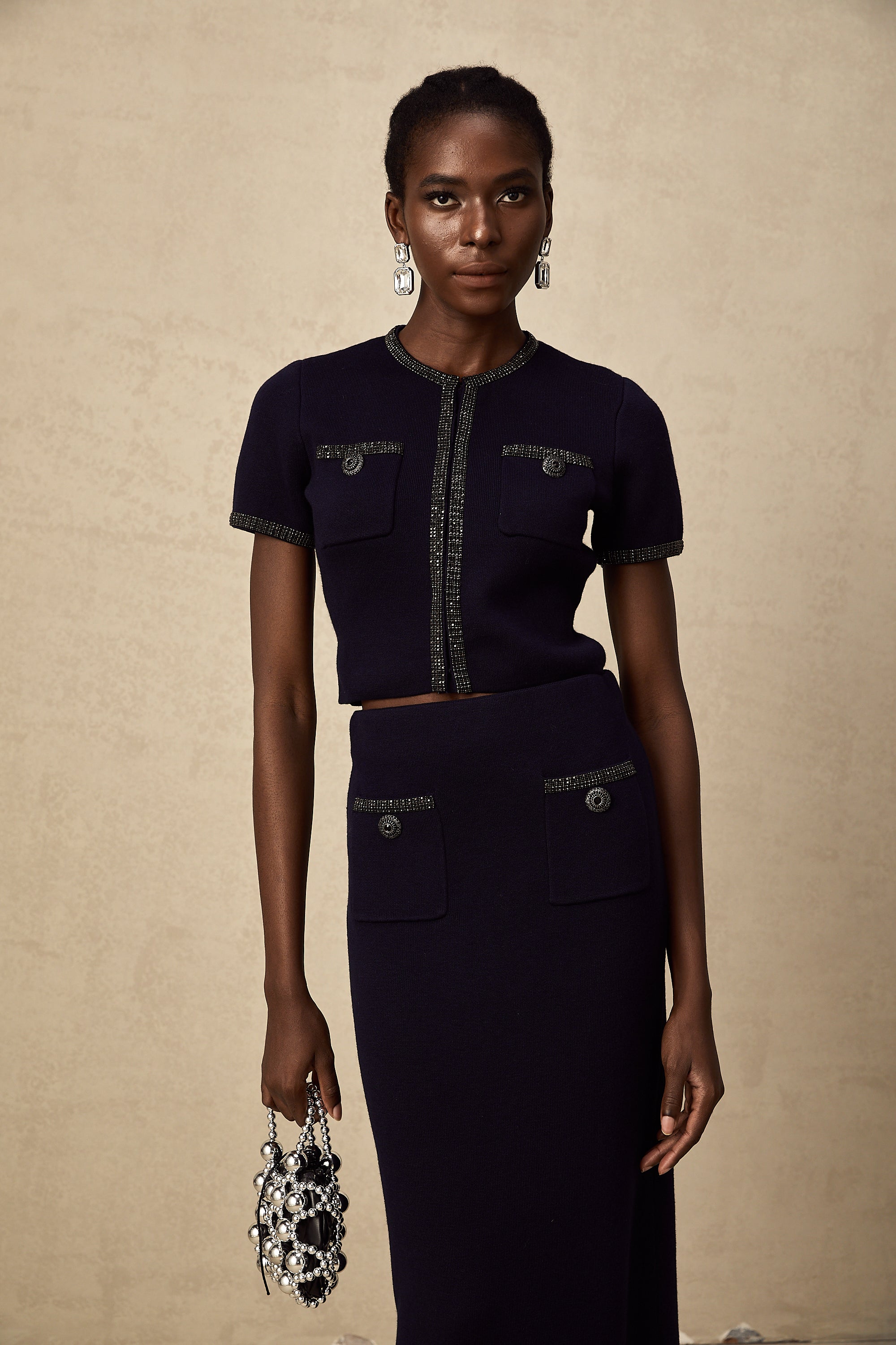 طقم Aïda المزين بقماش محبوك مضلع مكون من بلوزة وتنورة متناسقة