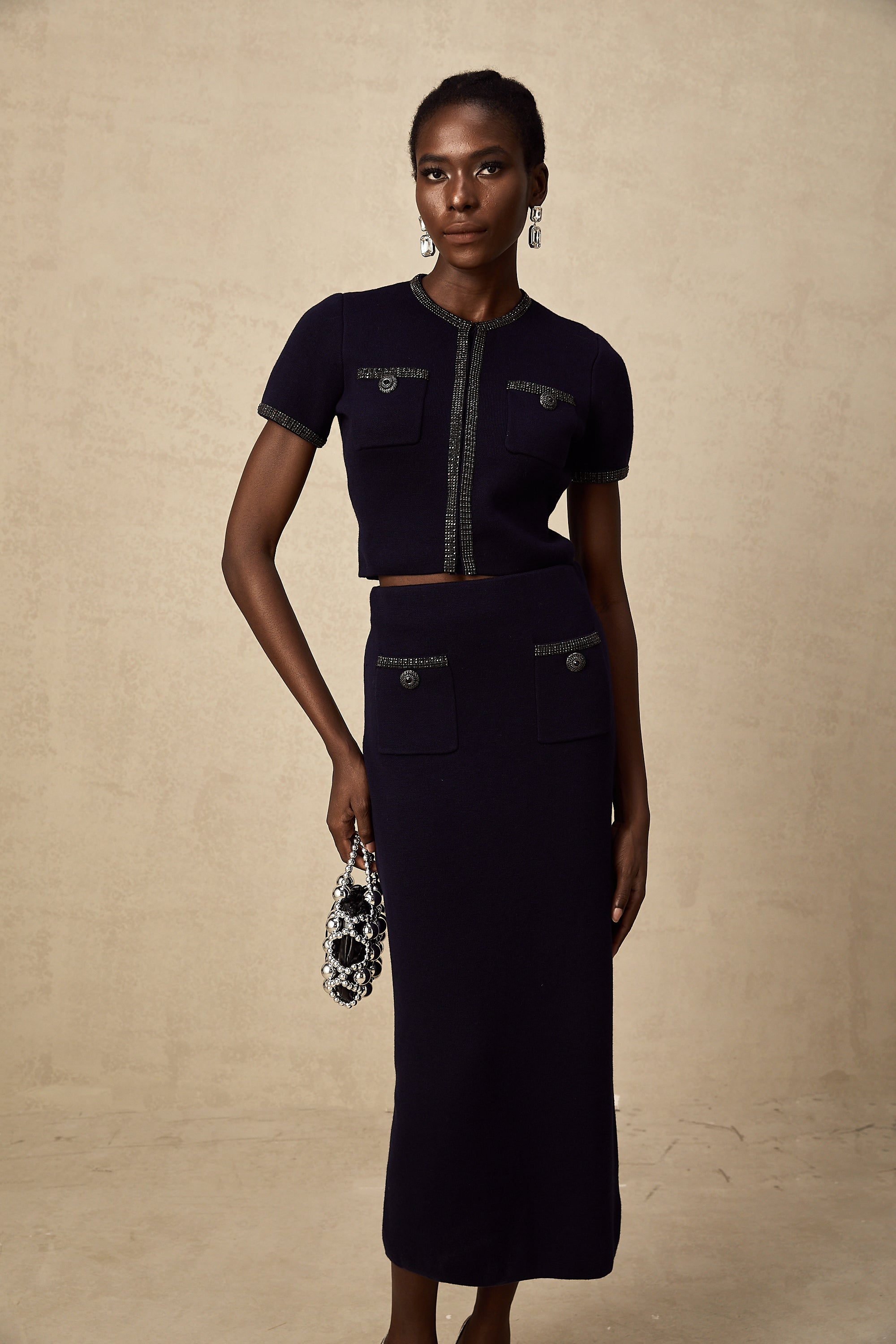 طقم Aïda المزين بقماش محبوك مضلع مكون من بلوزة وتنورة متناسقة