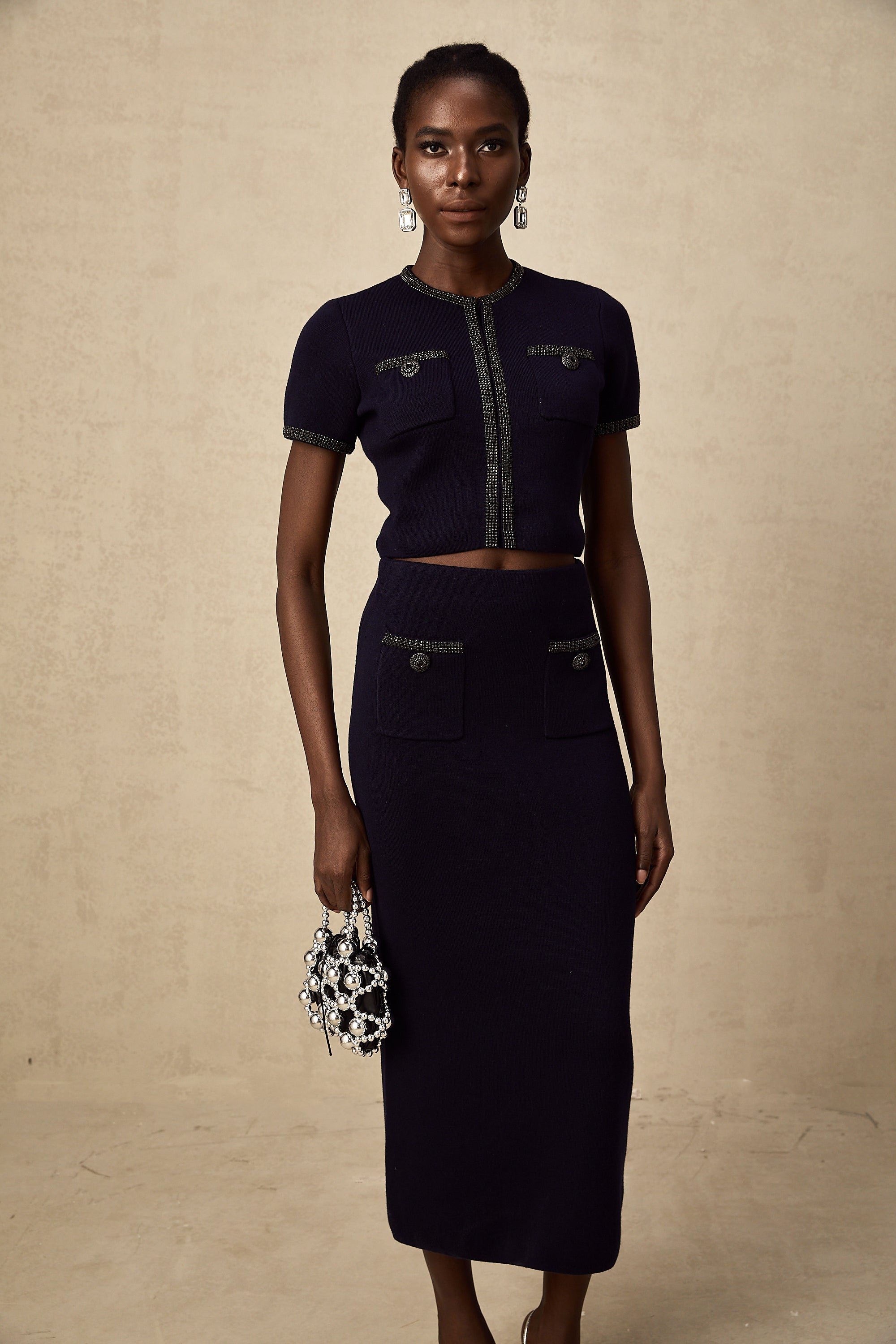 طقم Aïda المزين بقماش محبوك مضلع مكون من بلوزة وتنورة متناسقة