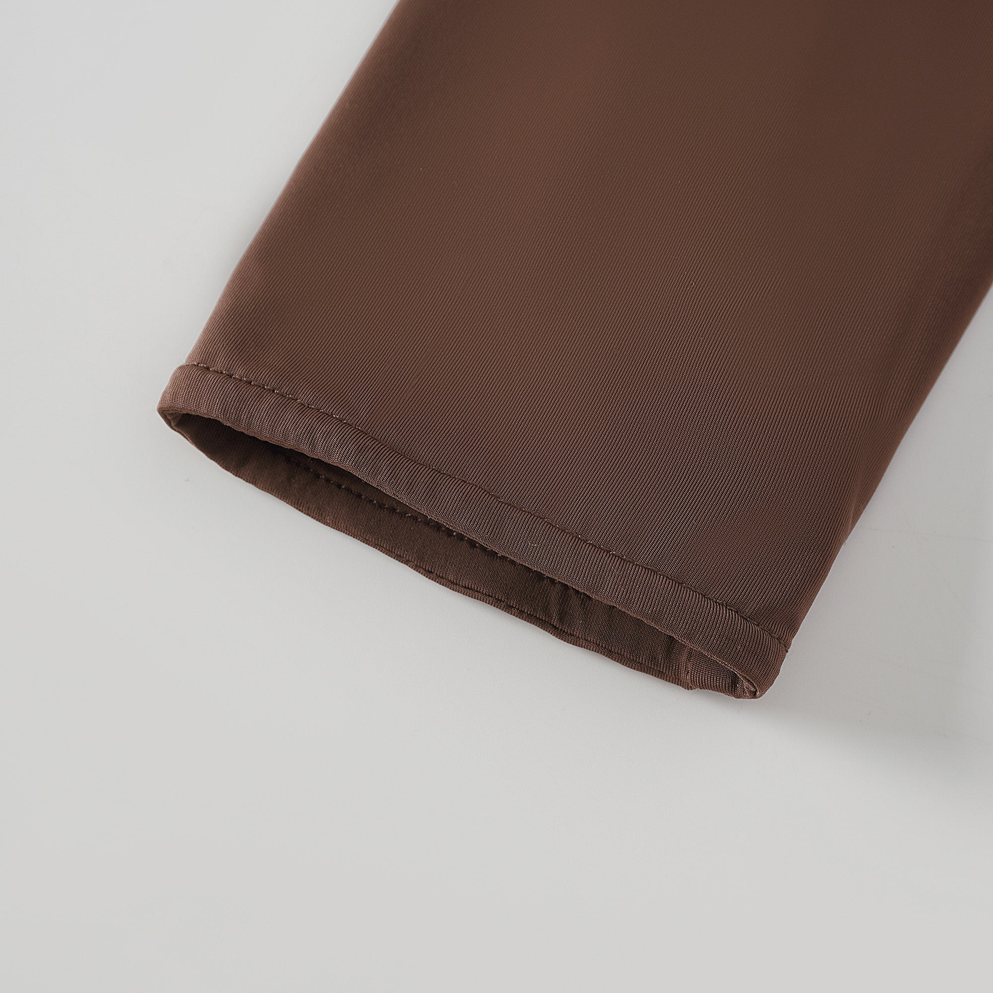 Brown turtleneck long-sleeved midi dress with a ruched skirt