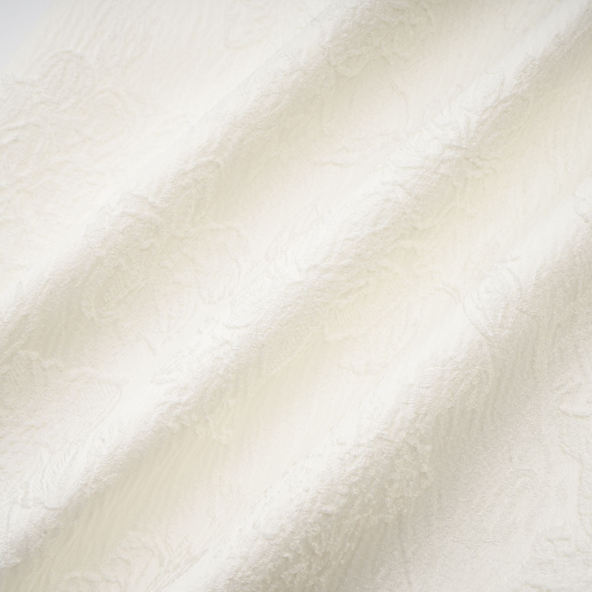 Coralie weißes Minikleid mit Knöpfen und Blütenblatt-Detail