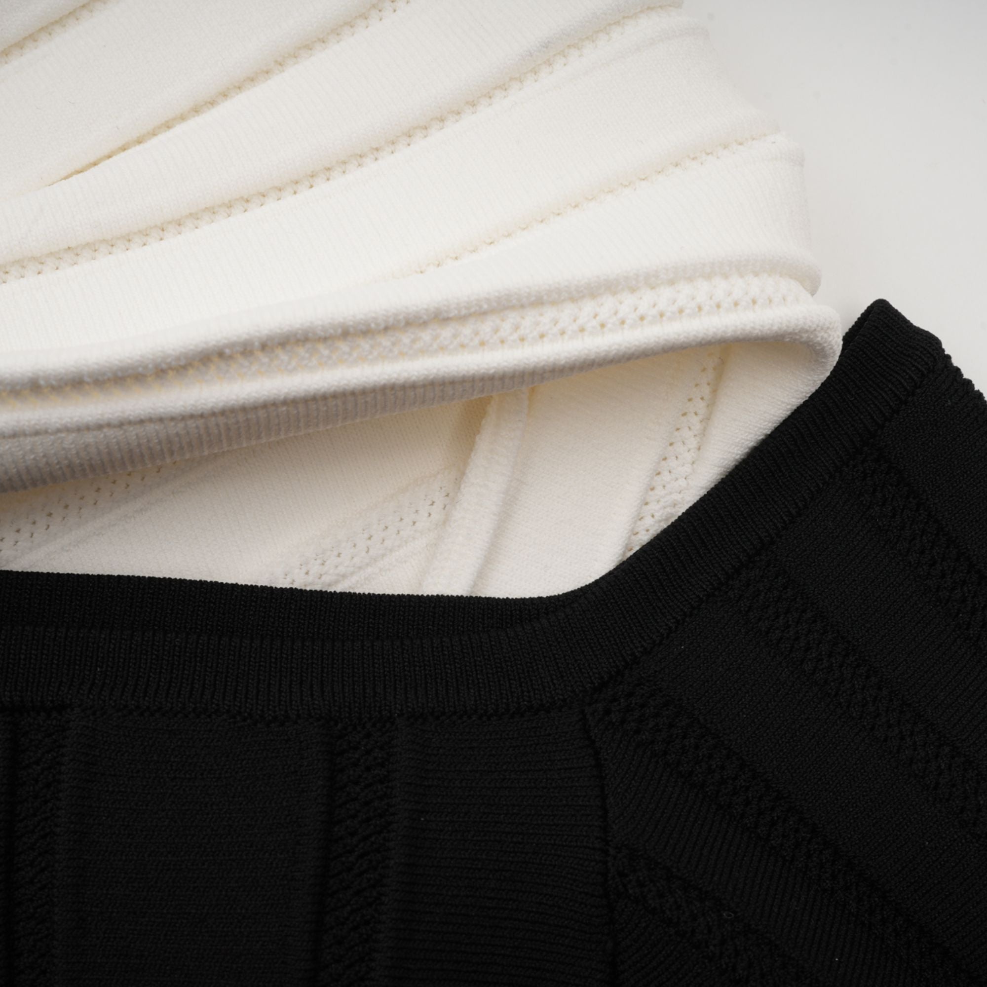 Justine black off-shoulder bow knit mini dress