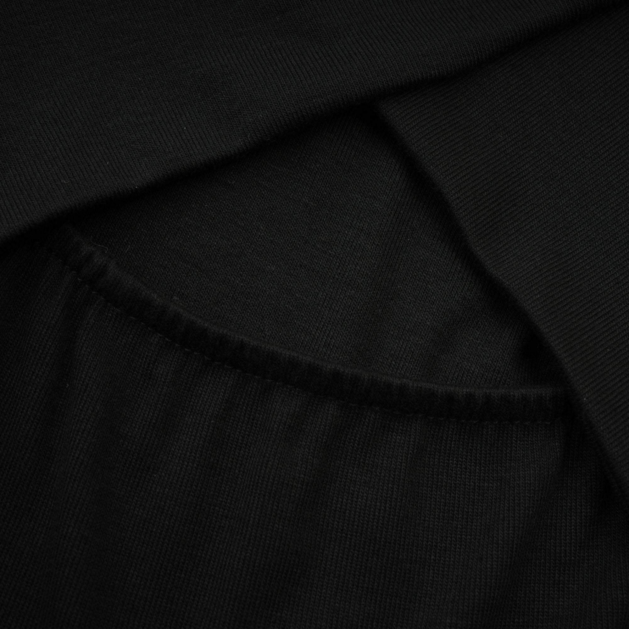 بلوزة أوديت من قماش الجيرسي المطاطي باللون الأسود