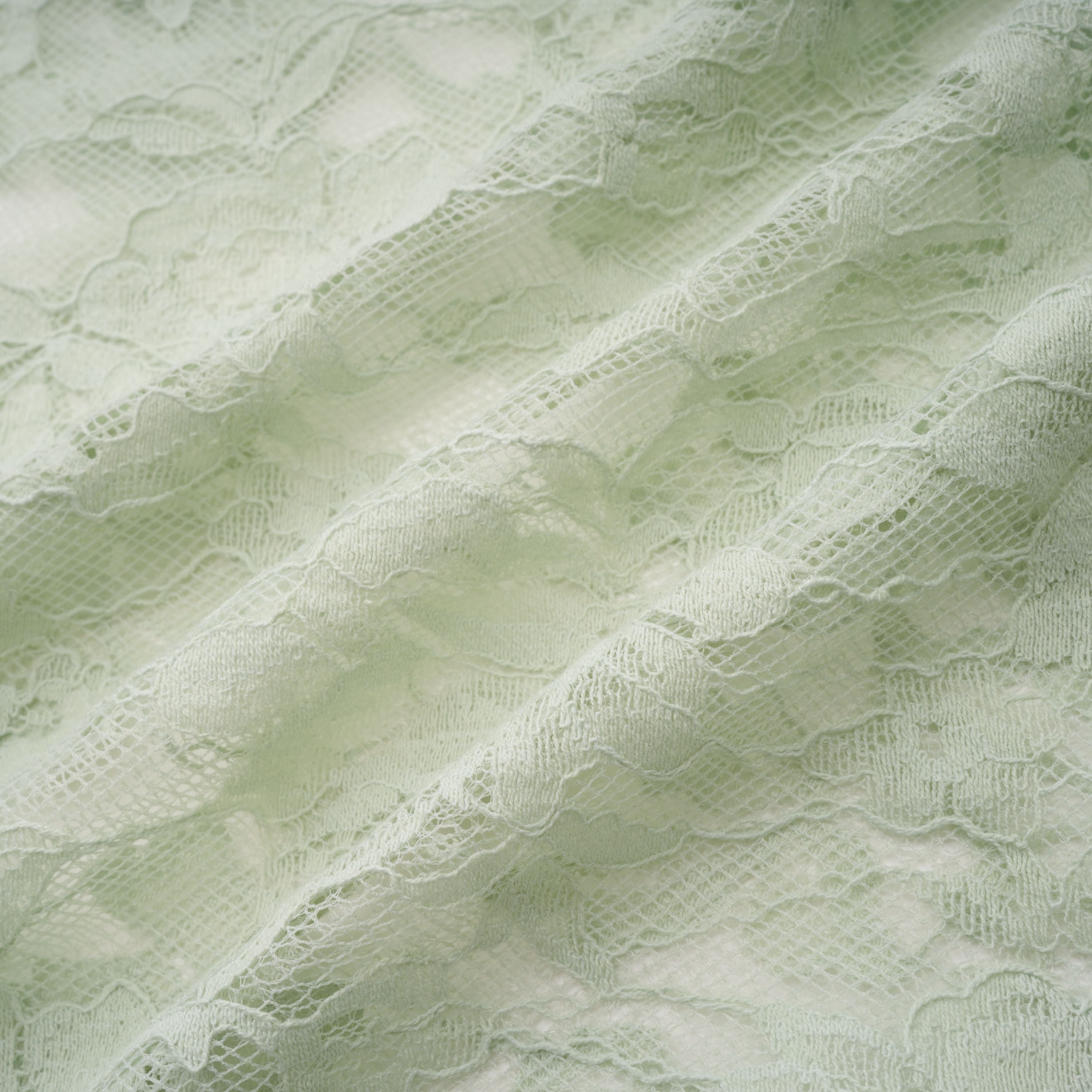 فستان قصير من الدانتيل الزهري شبه الشفاف بلون أخضر ساج من أليكسيس