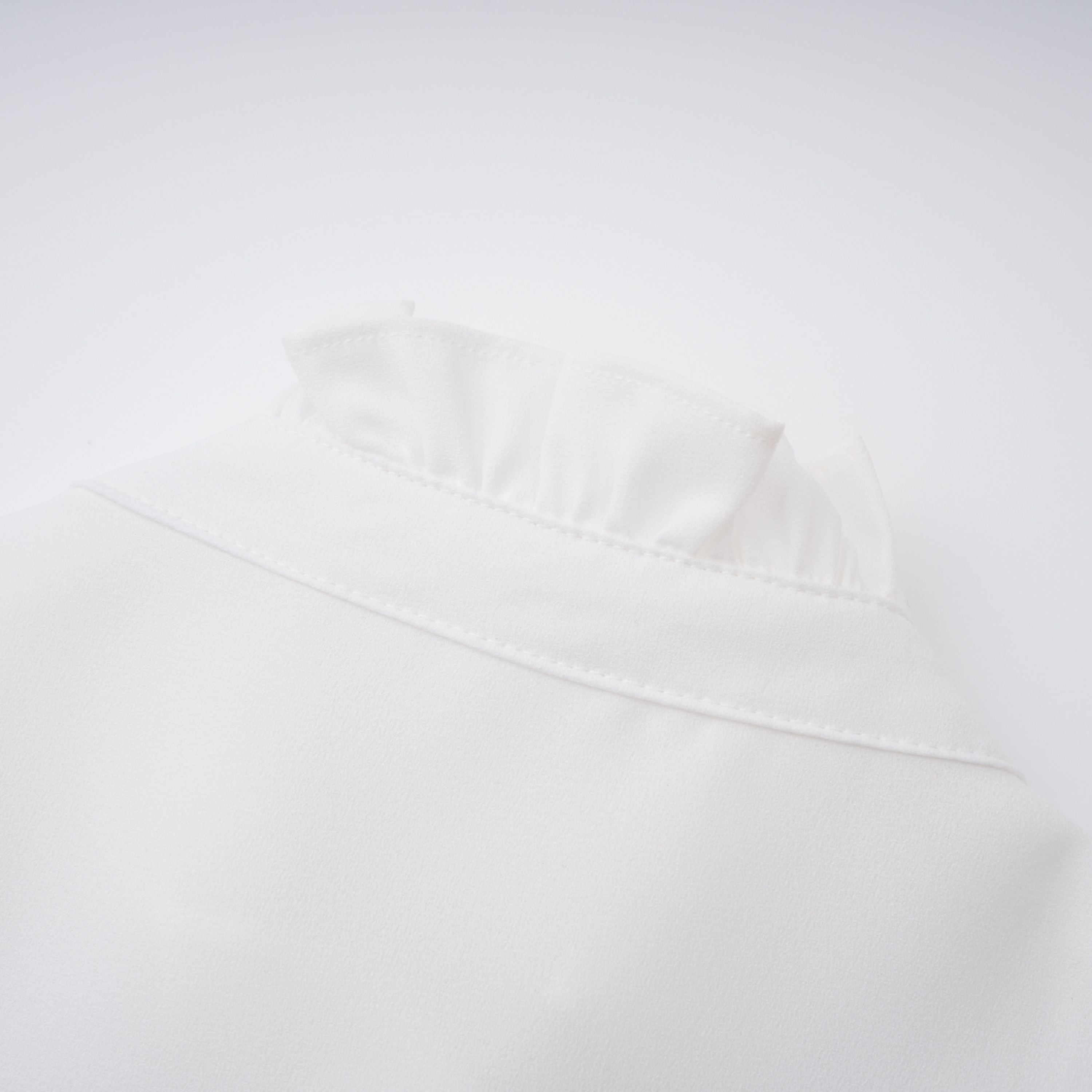 Paulette white bowknot shirred-panel ruffled shirt