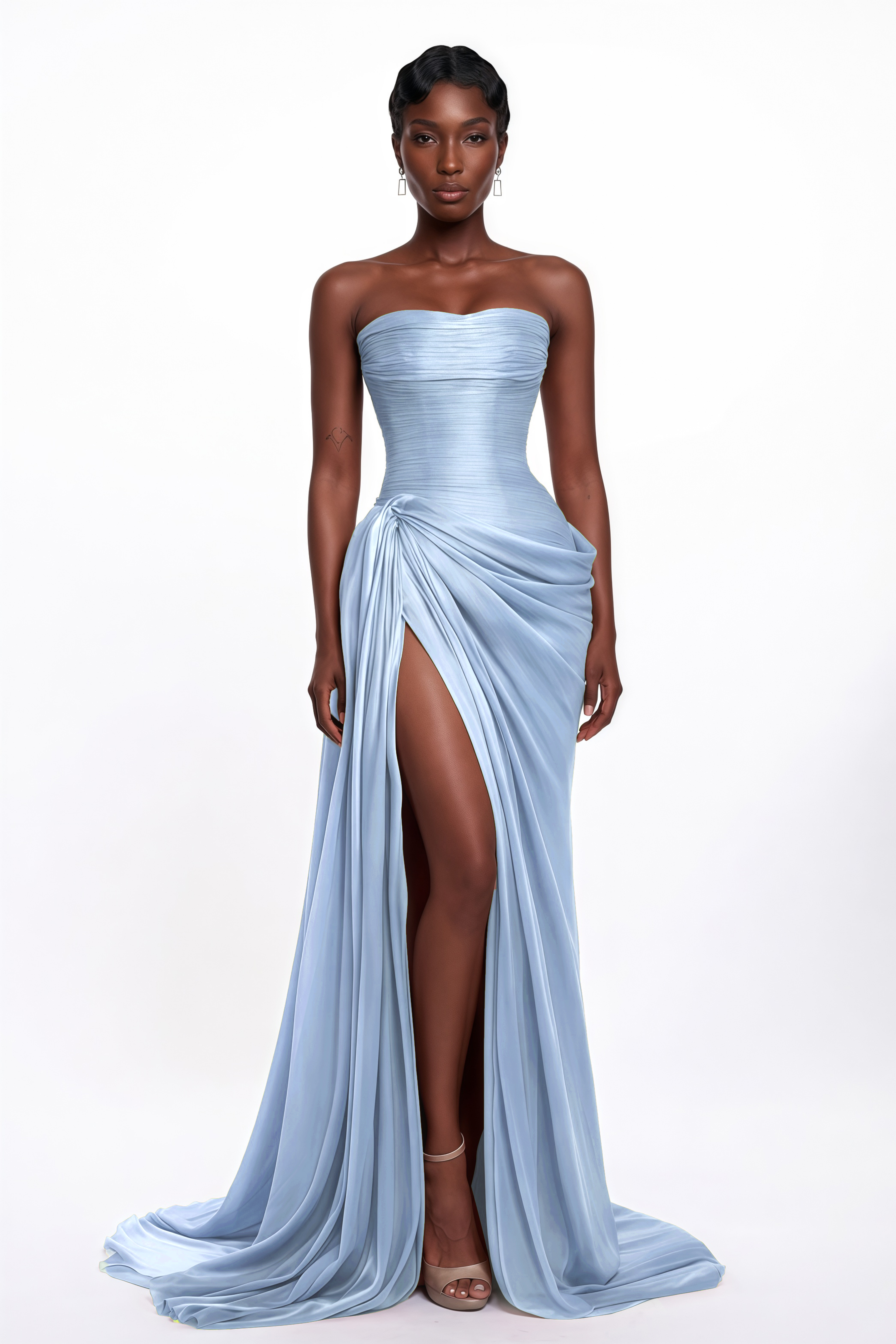 Light blue strapless gown featuring a finely pleated corset bodice and an asymmetric draped high-slit skirt
