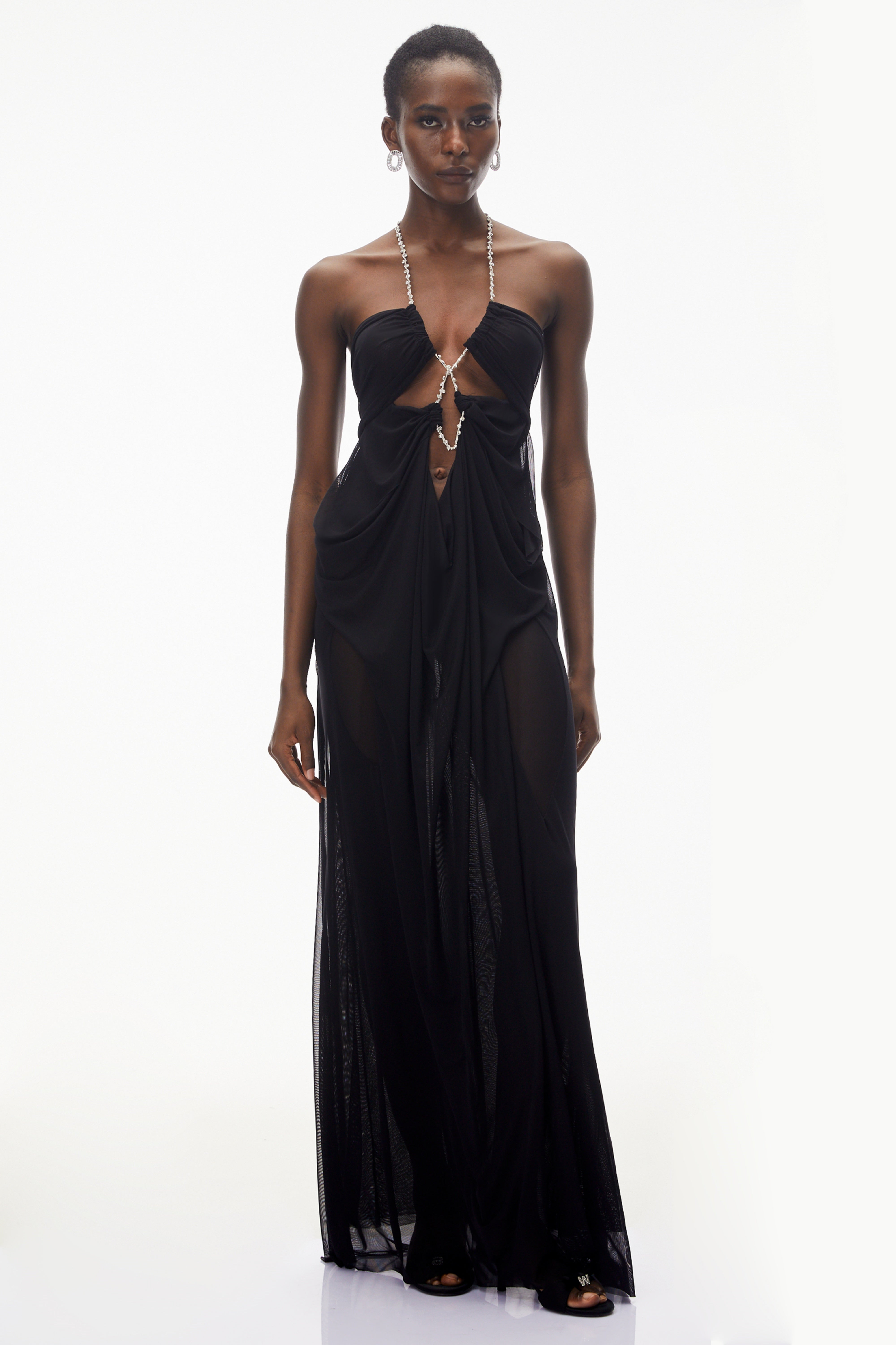 Robe longue noire à dos nu avec découpes ornées de cristaux