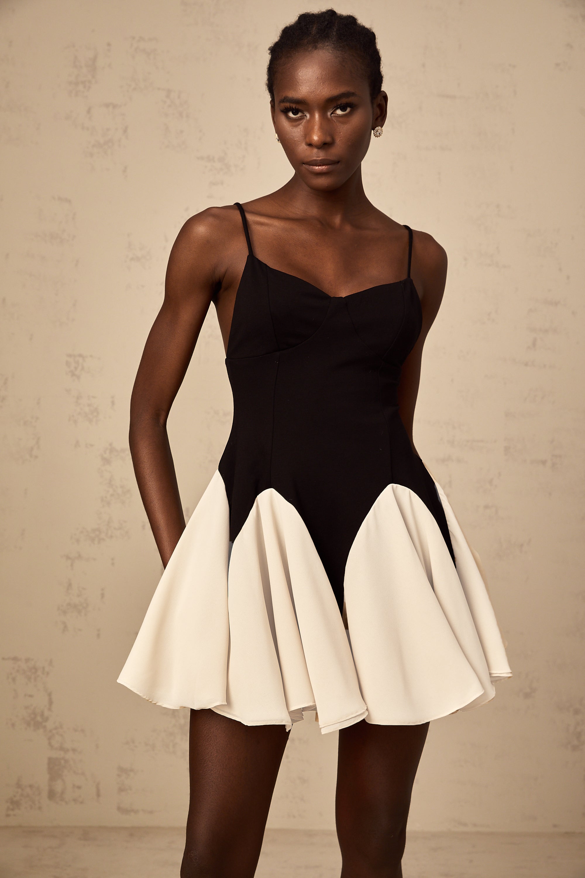 Justine color-blocked godet pleated mini dress