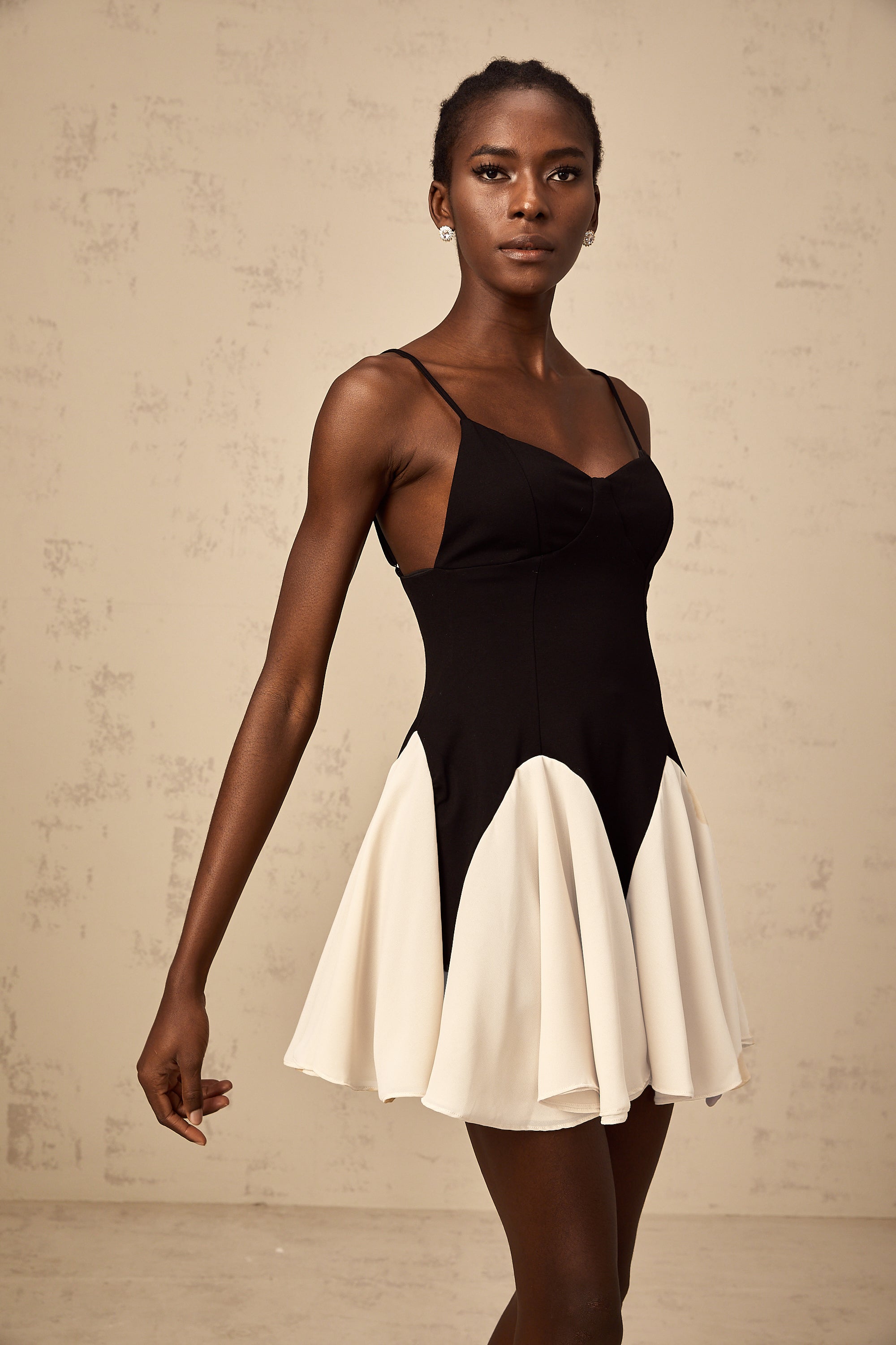 Justine color-blocked godet pleated mini dress