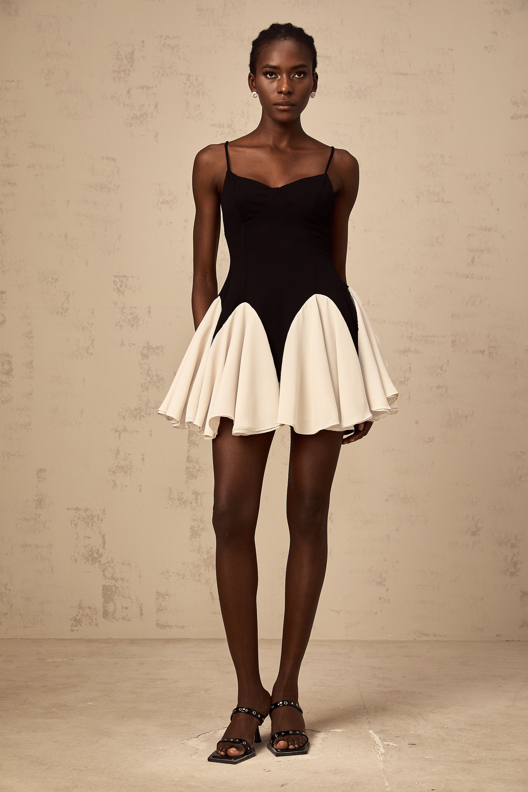 Justine color-blocked godet pleated mini dress