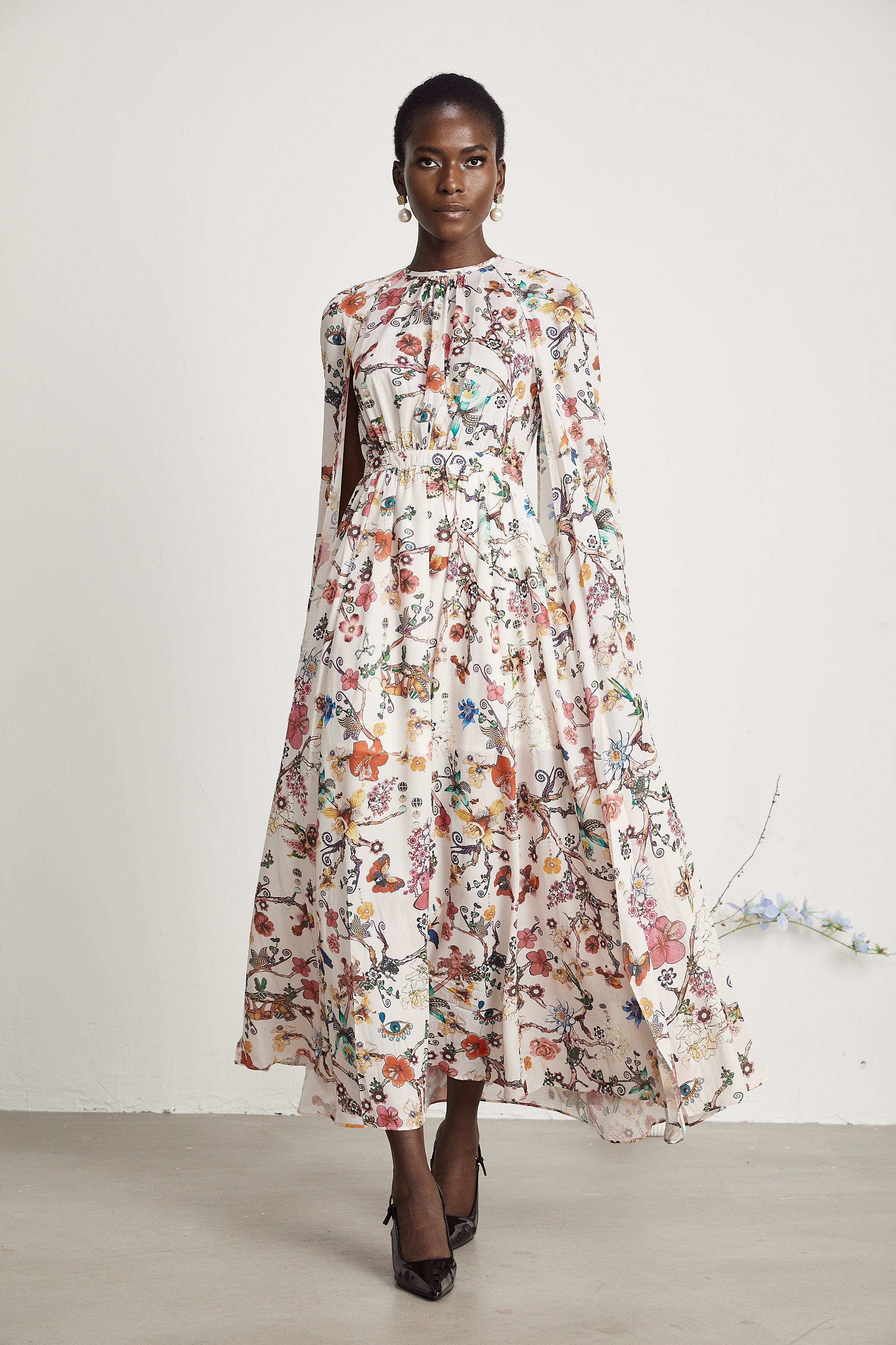 Elara floral-print cape-design maxi dress