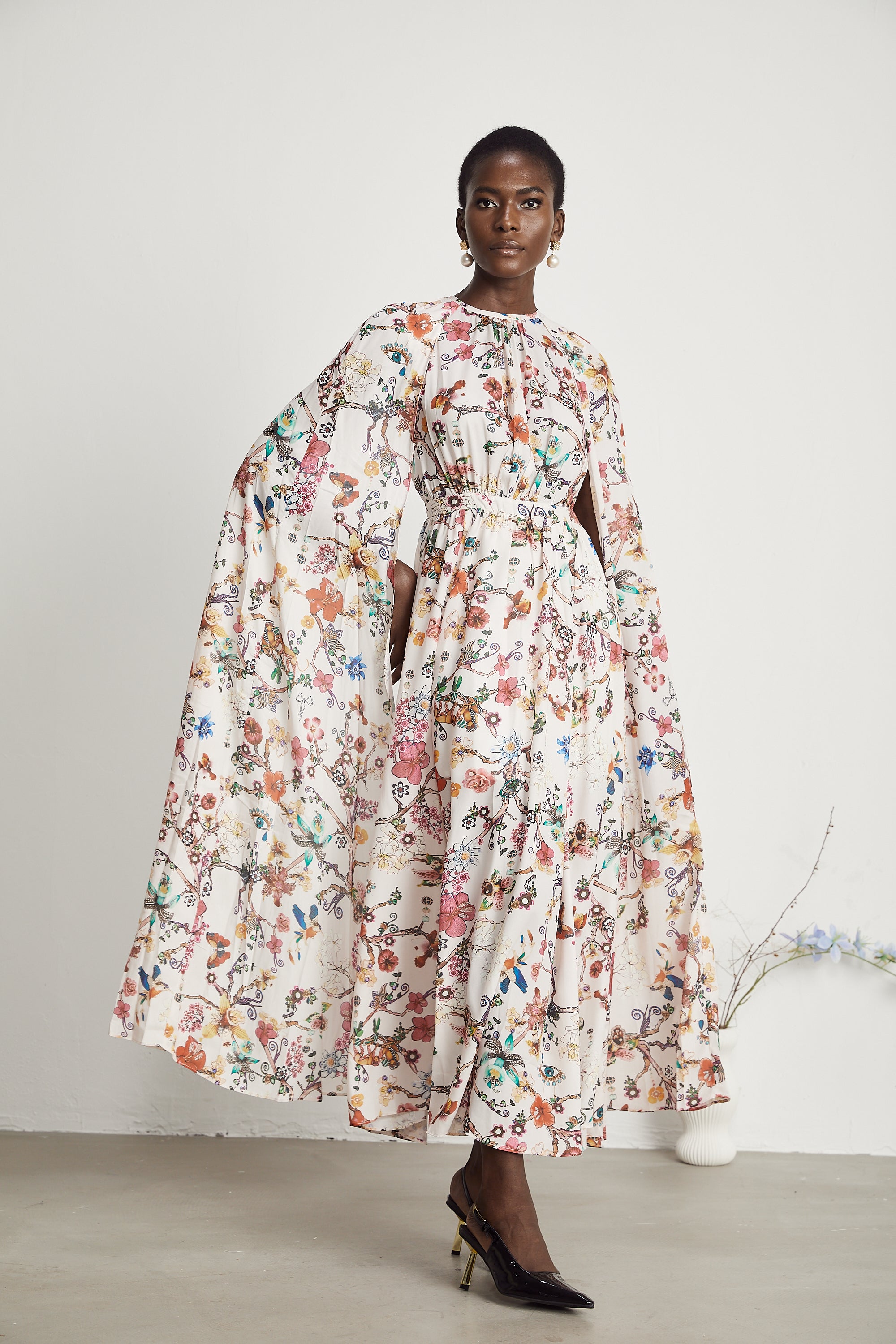 Elara floral-print cape-design maxi dress