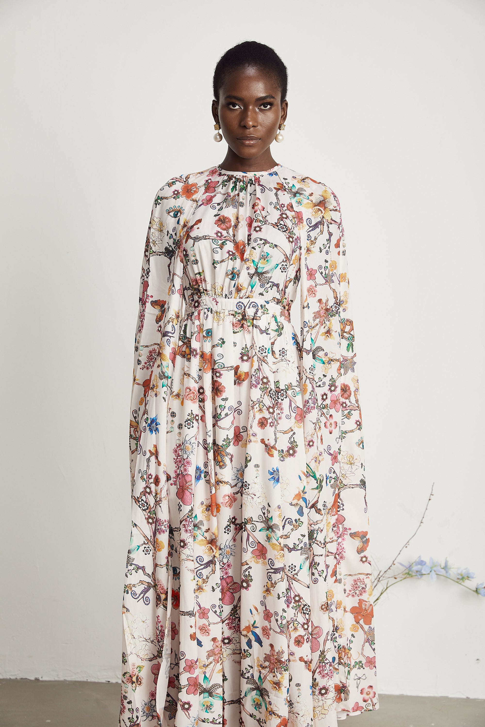 Elara floral-print cape-design maxi dress