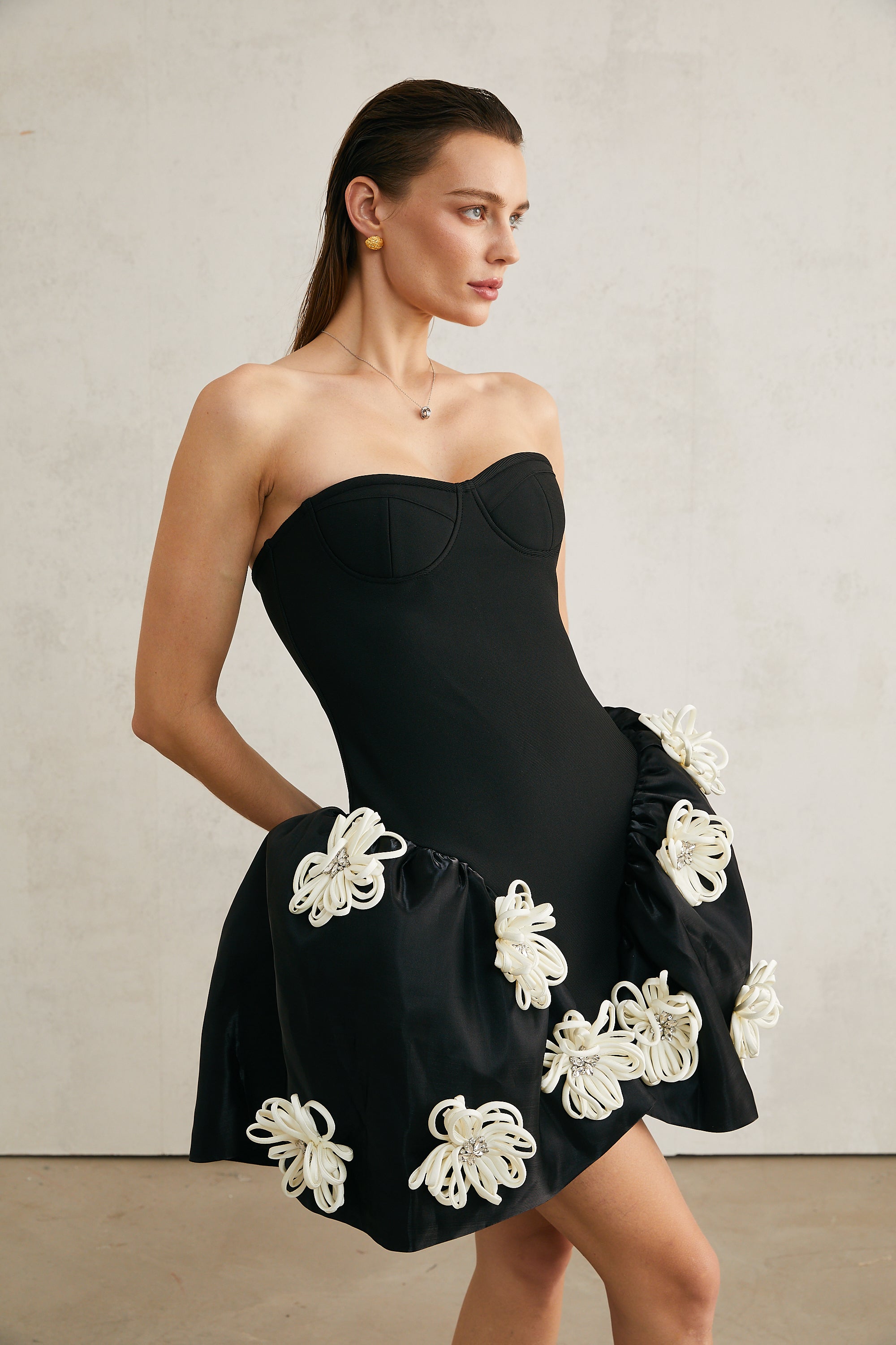 Léonor black floral-appliqué peplum mini dress