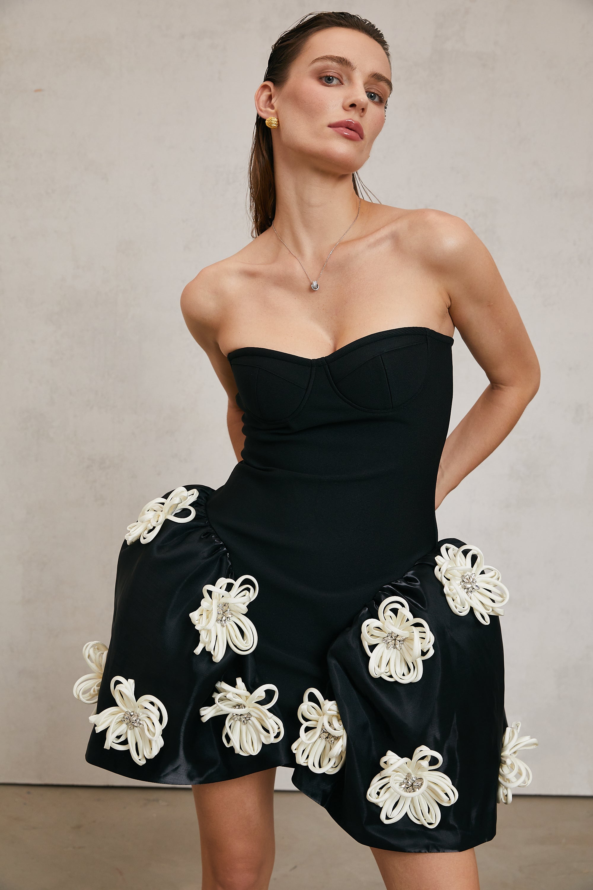 Léonor black floral-appliqué peplum mini dress