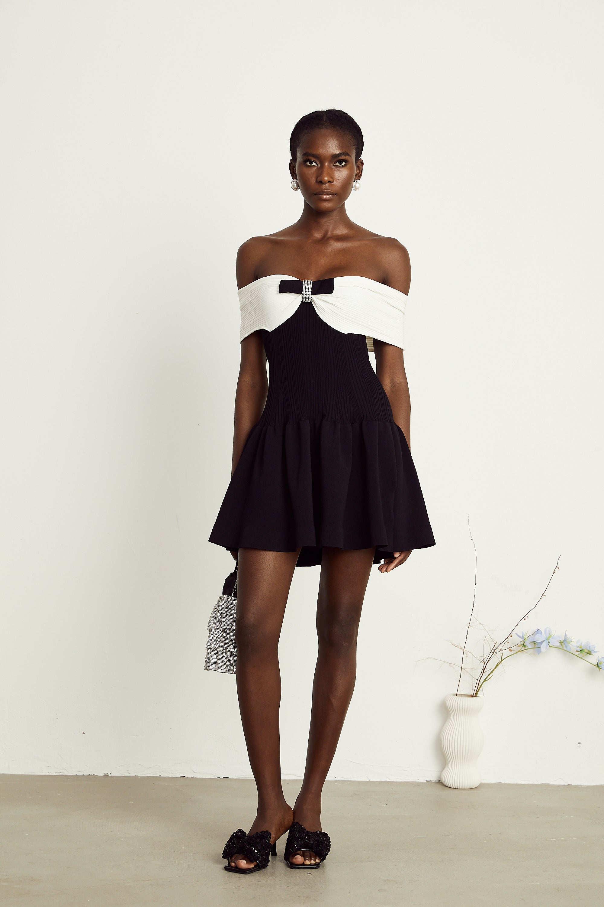 Angèle black off-shoulder knitted mini dress