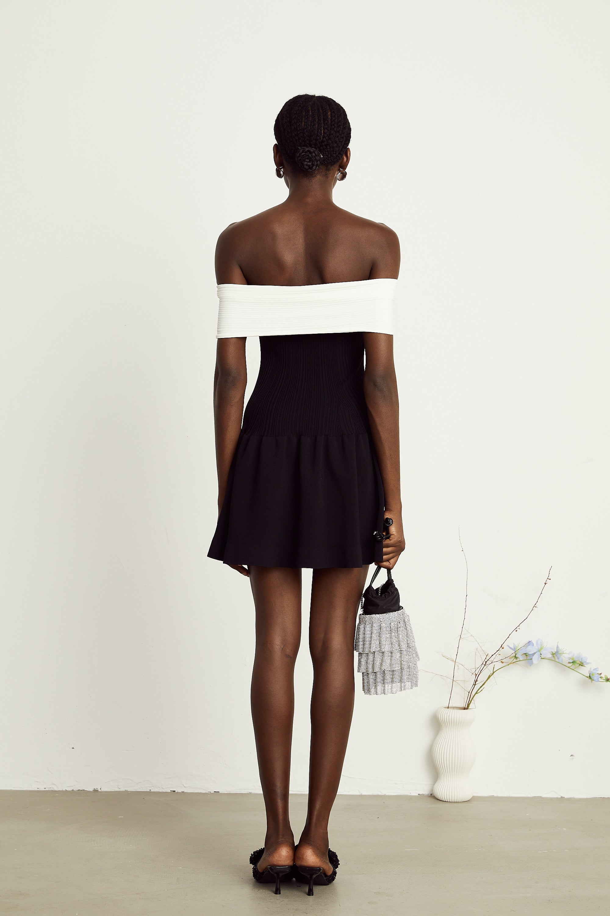 Angèle black off-shoulder knitted mini dress