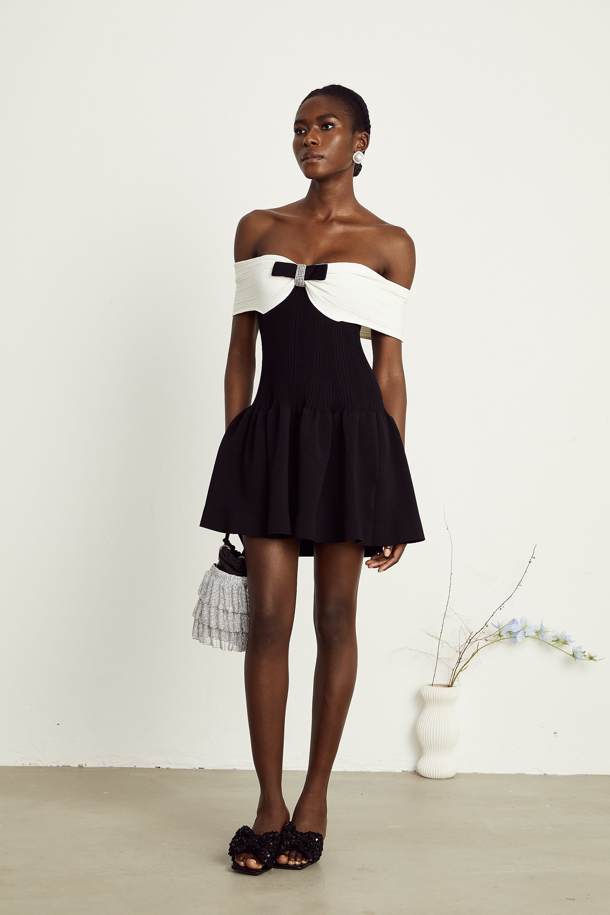 Angèle black off-shoulder knitted mini dress