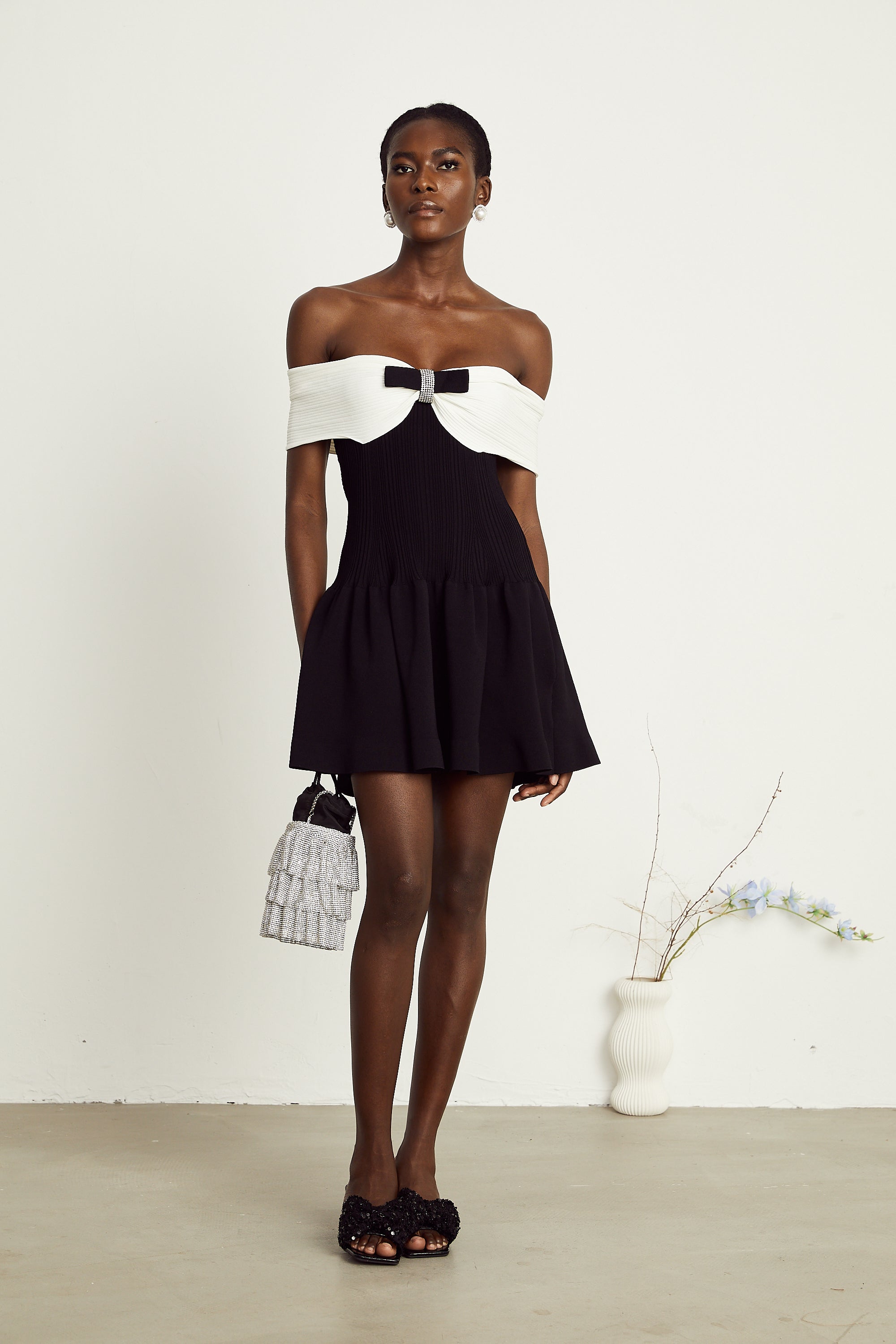 Angèle black off-shoulder knitted mini dress