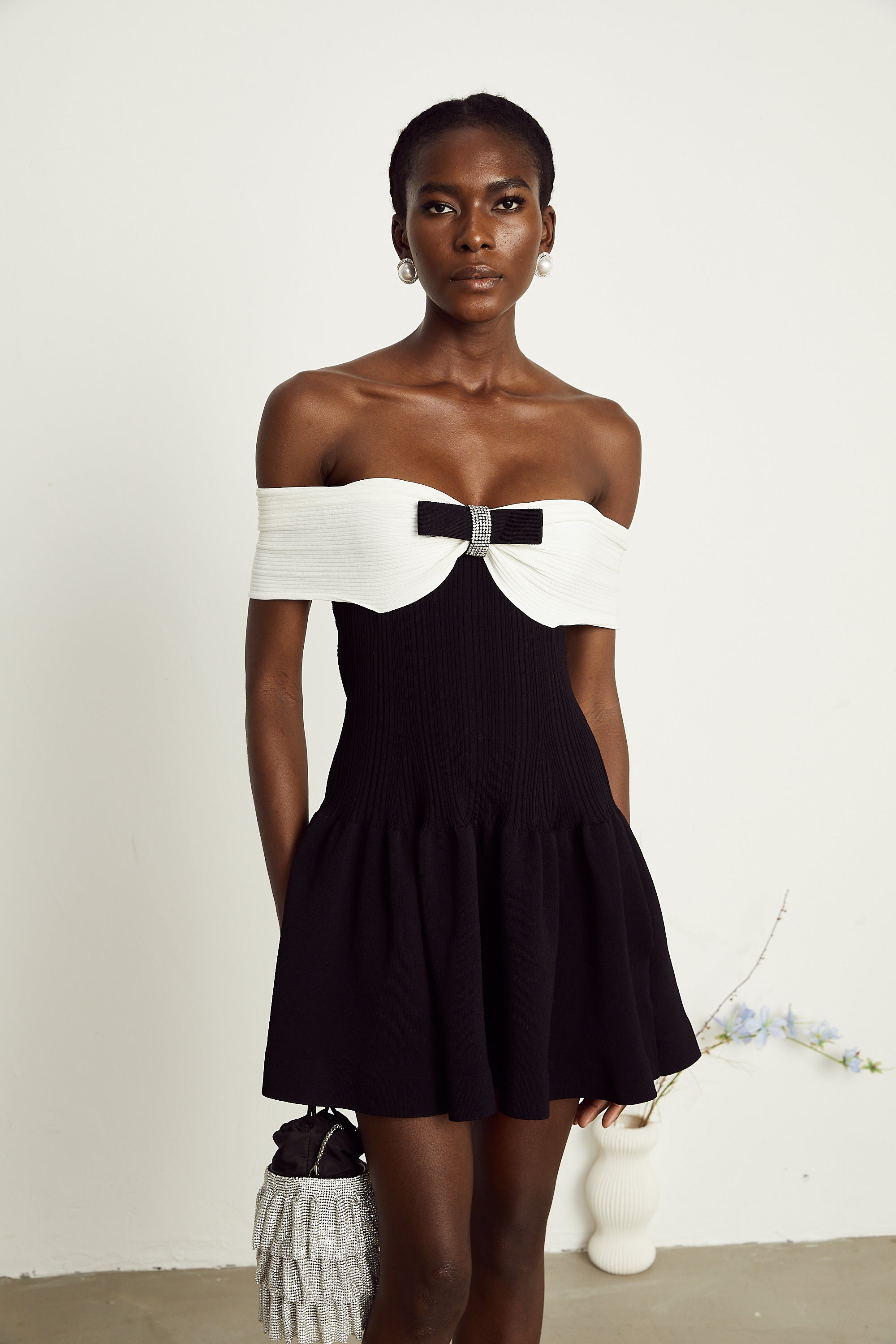 Angèle black off-shoulder knitted mini dress