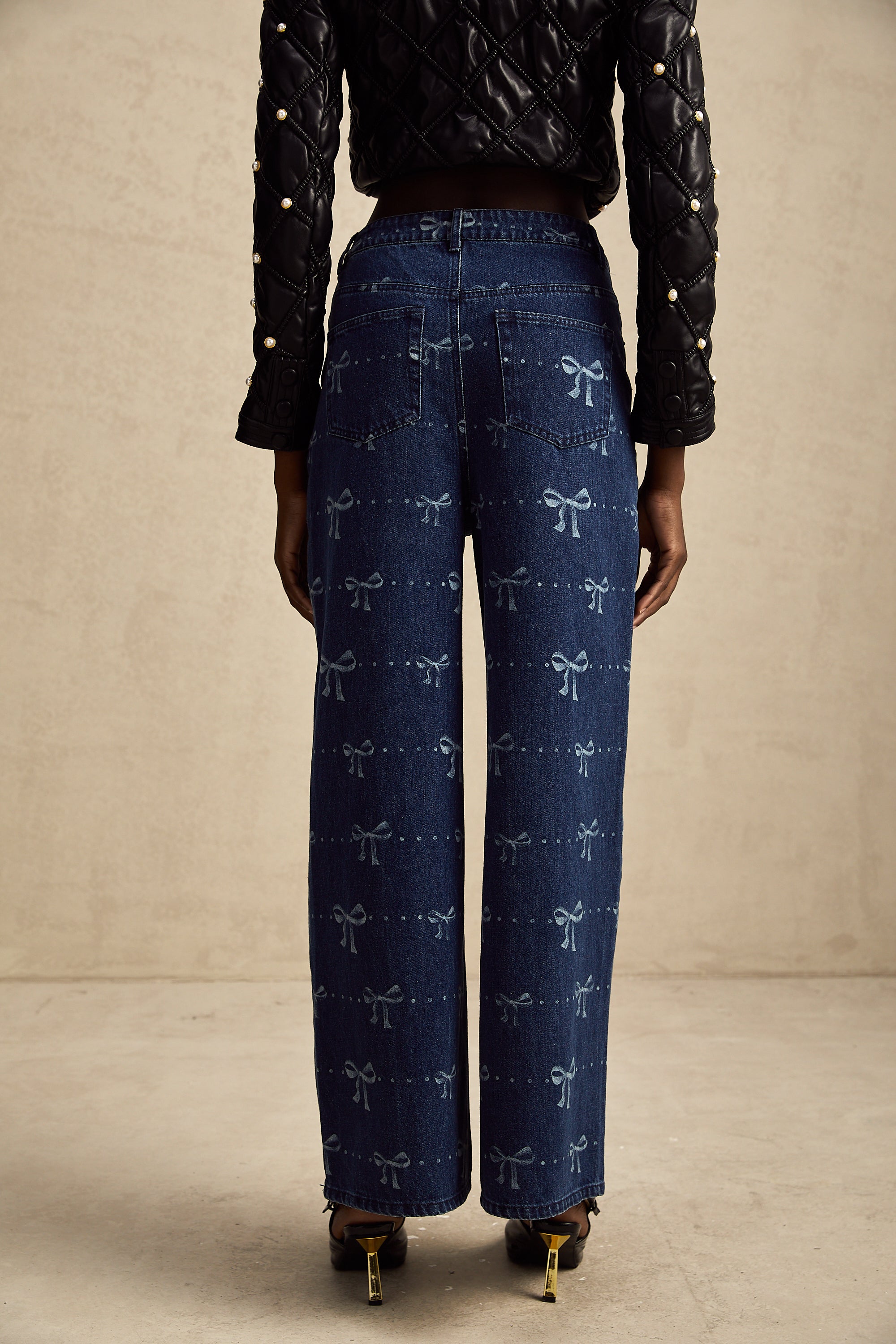 Yvonne bow-motif wide-leg jeans