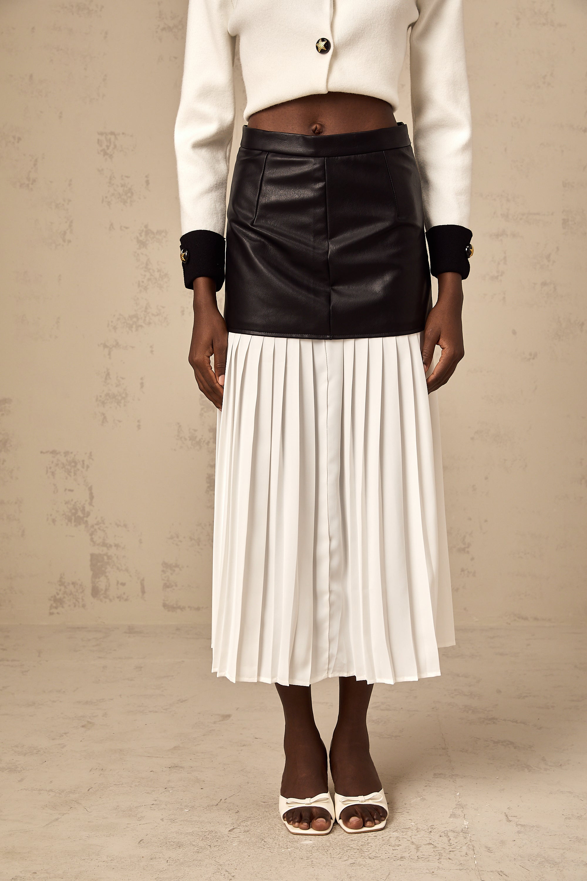 Aria color-blocked panelled pleated midi skirt