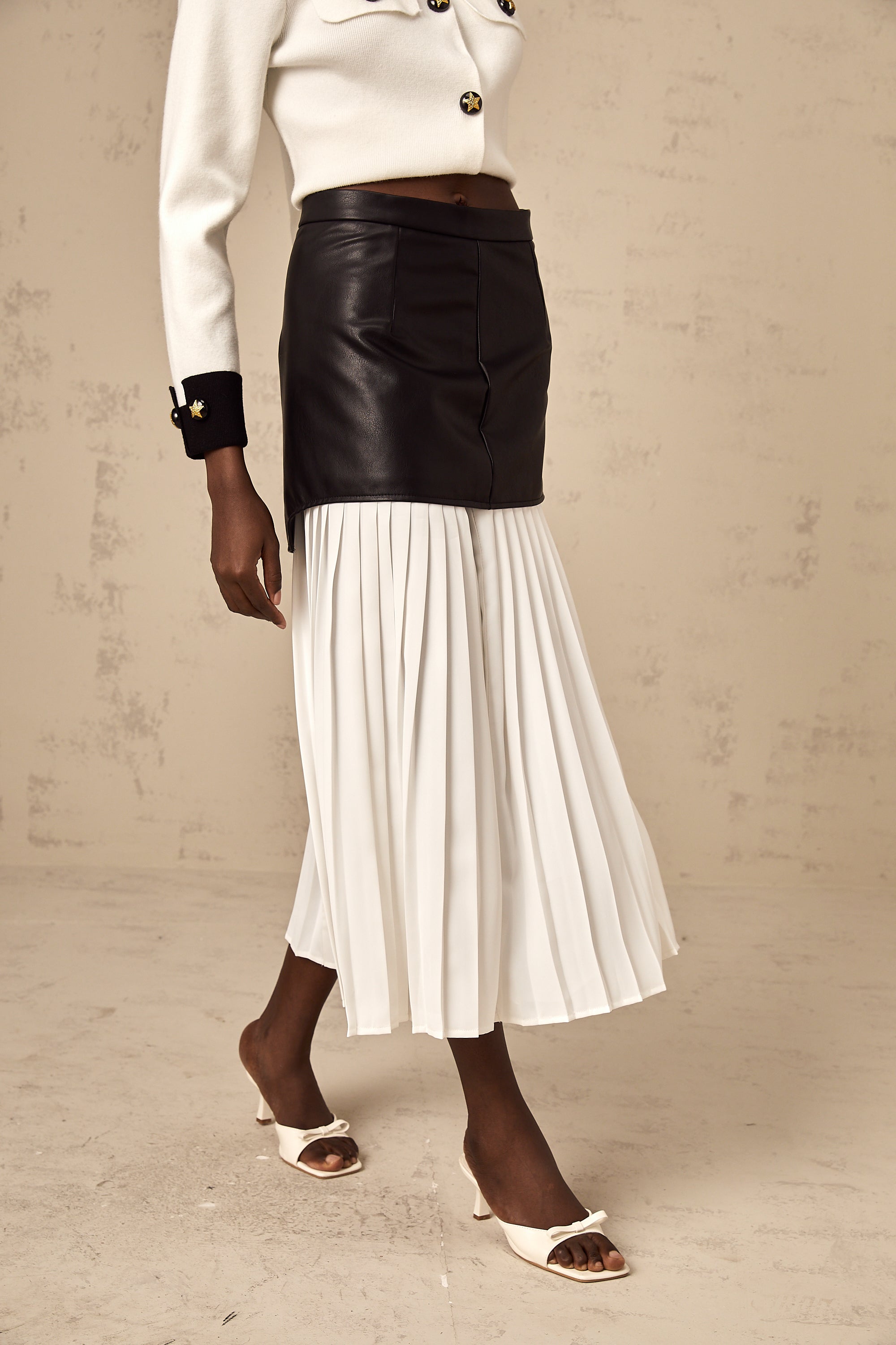 Aria color-blocked panelled pleated midi skirt