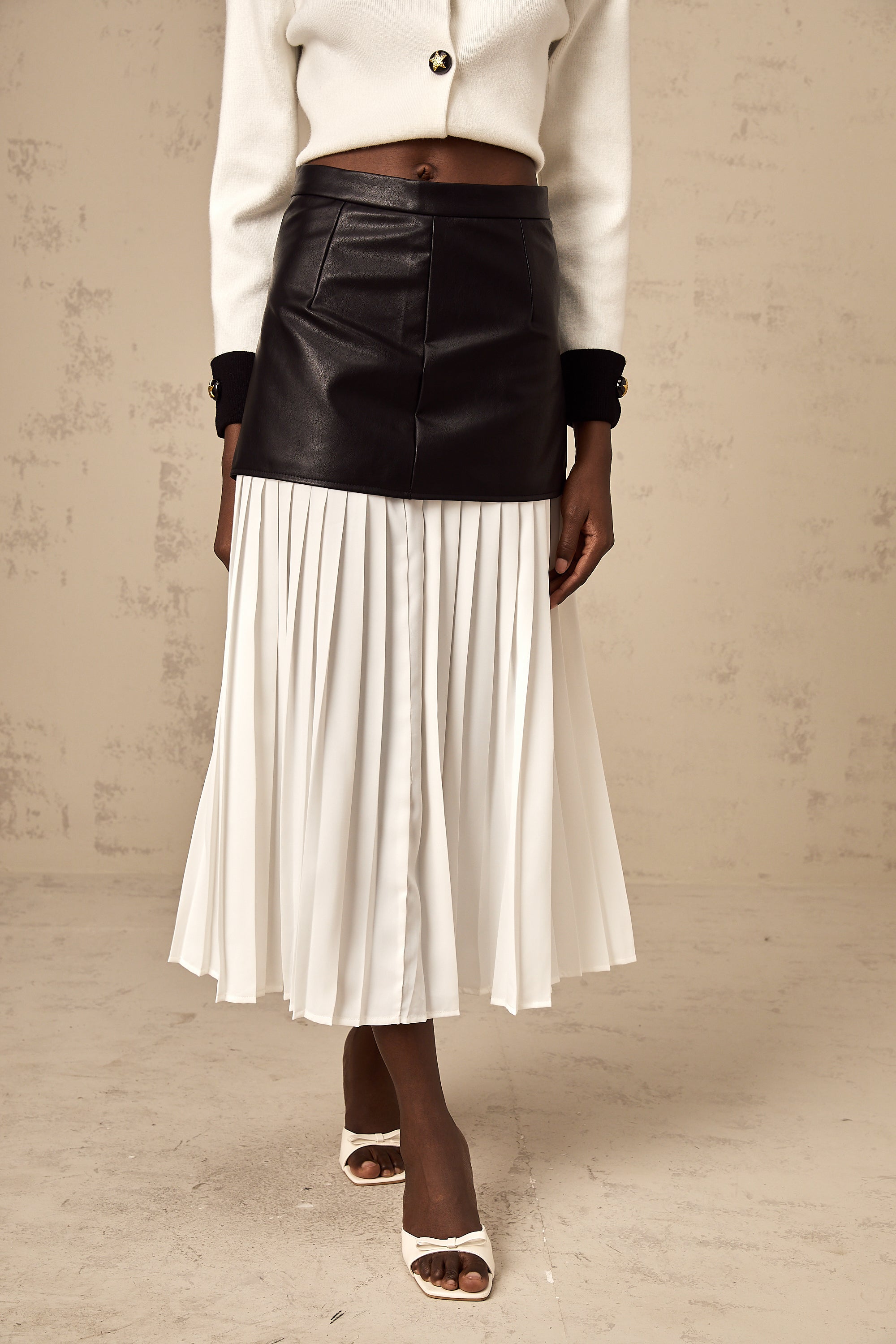 Aria color-blocked panelled pleated midi skirt