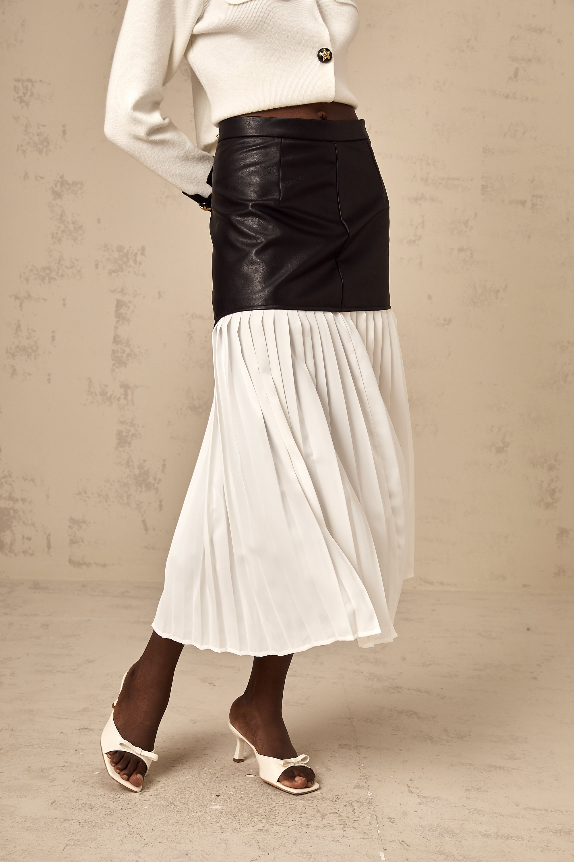 Aria color-blocked panelled pleated midi skirt