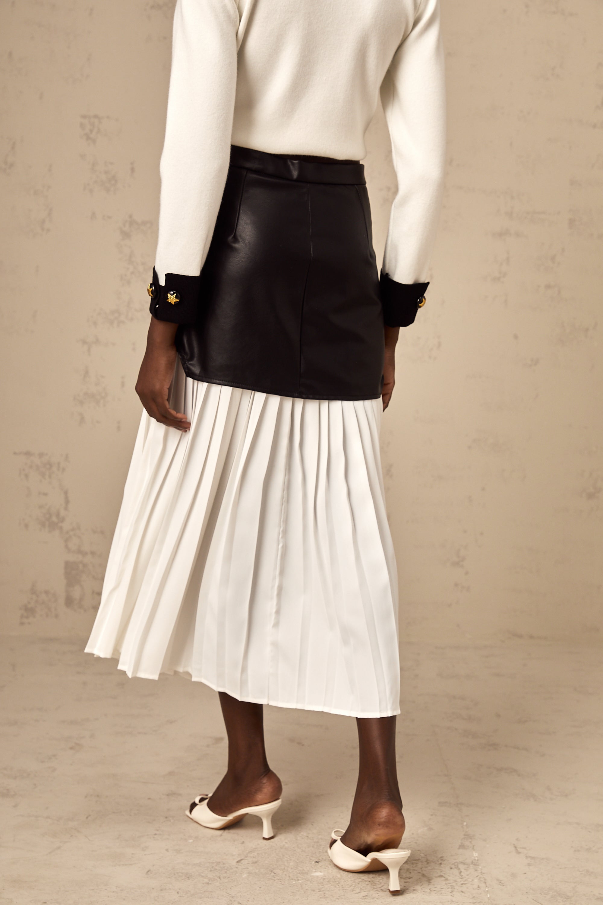 Aria color-blocked panelled pleated midi skirt