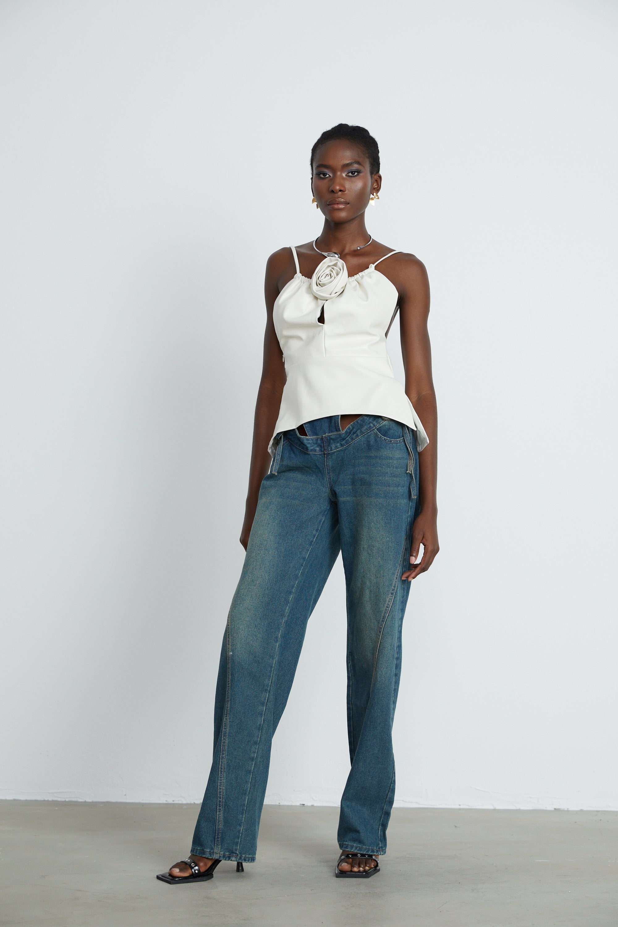 Sancia floral-appliqué leather top