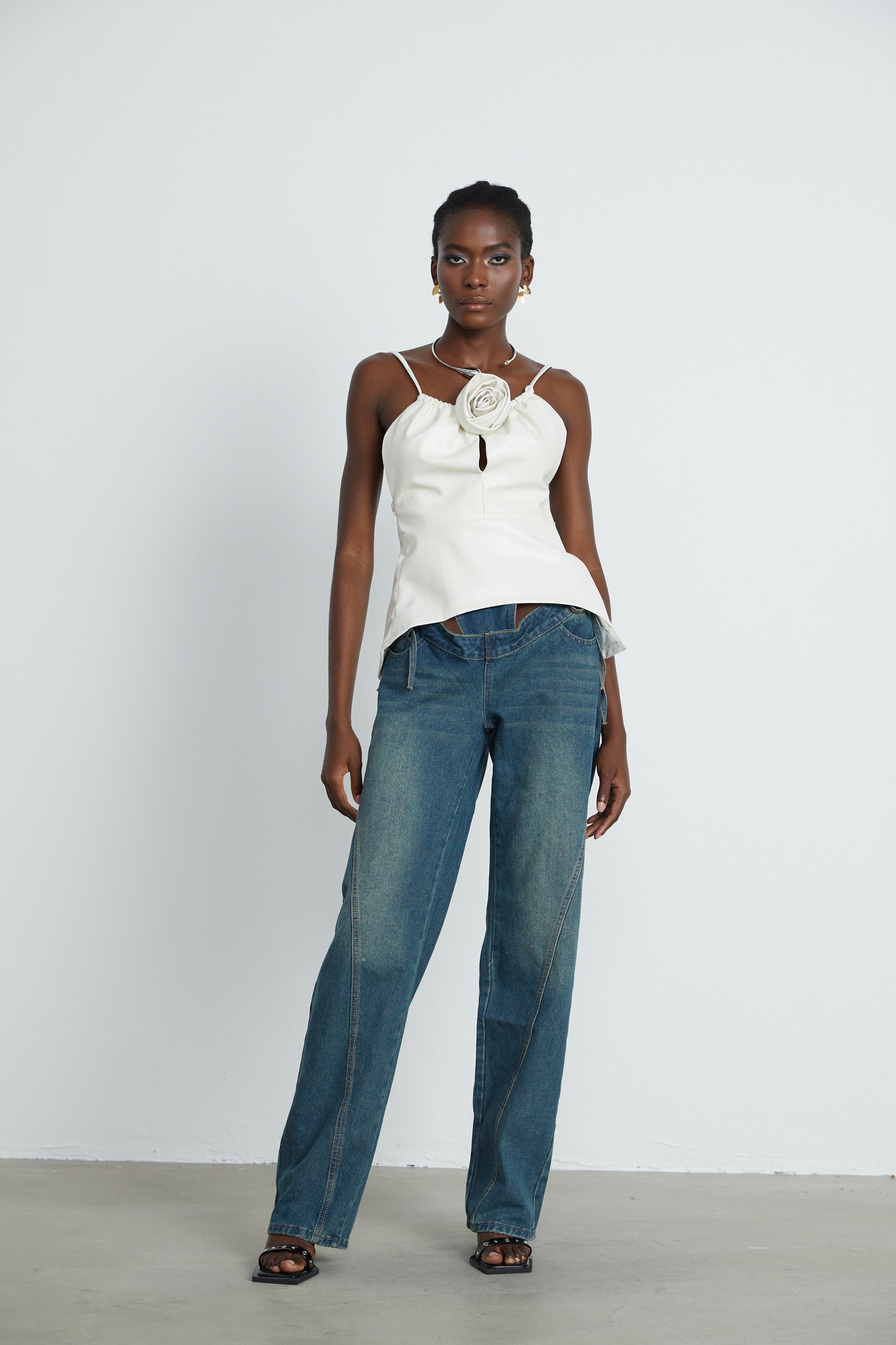 Sancia floral-appliqué leather top