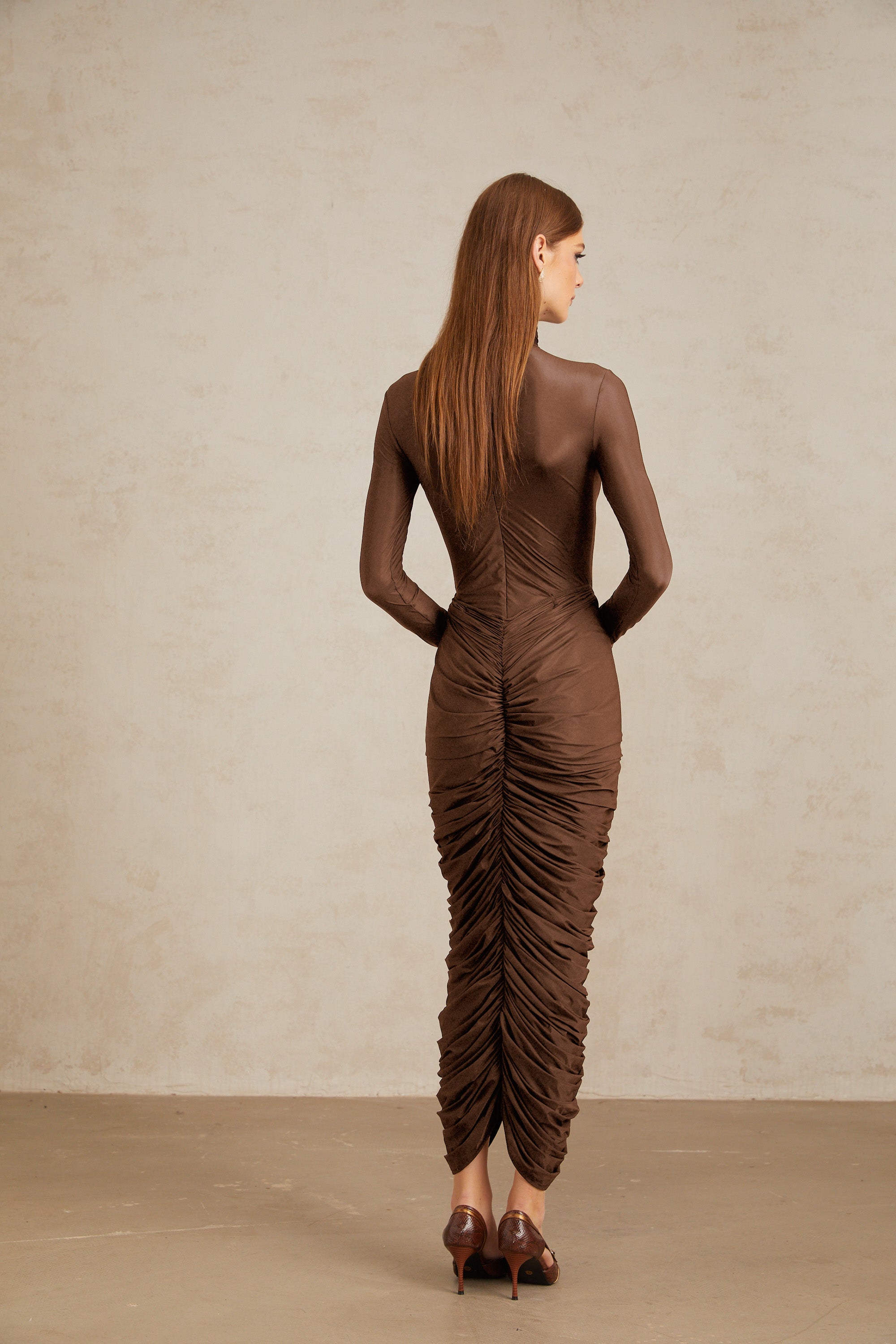 Brown turtleneck long-sleeved midi dress with a ruched skirt