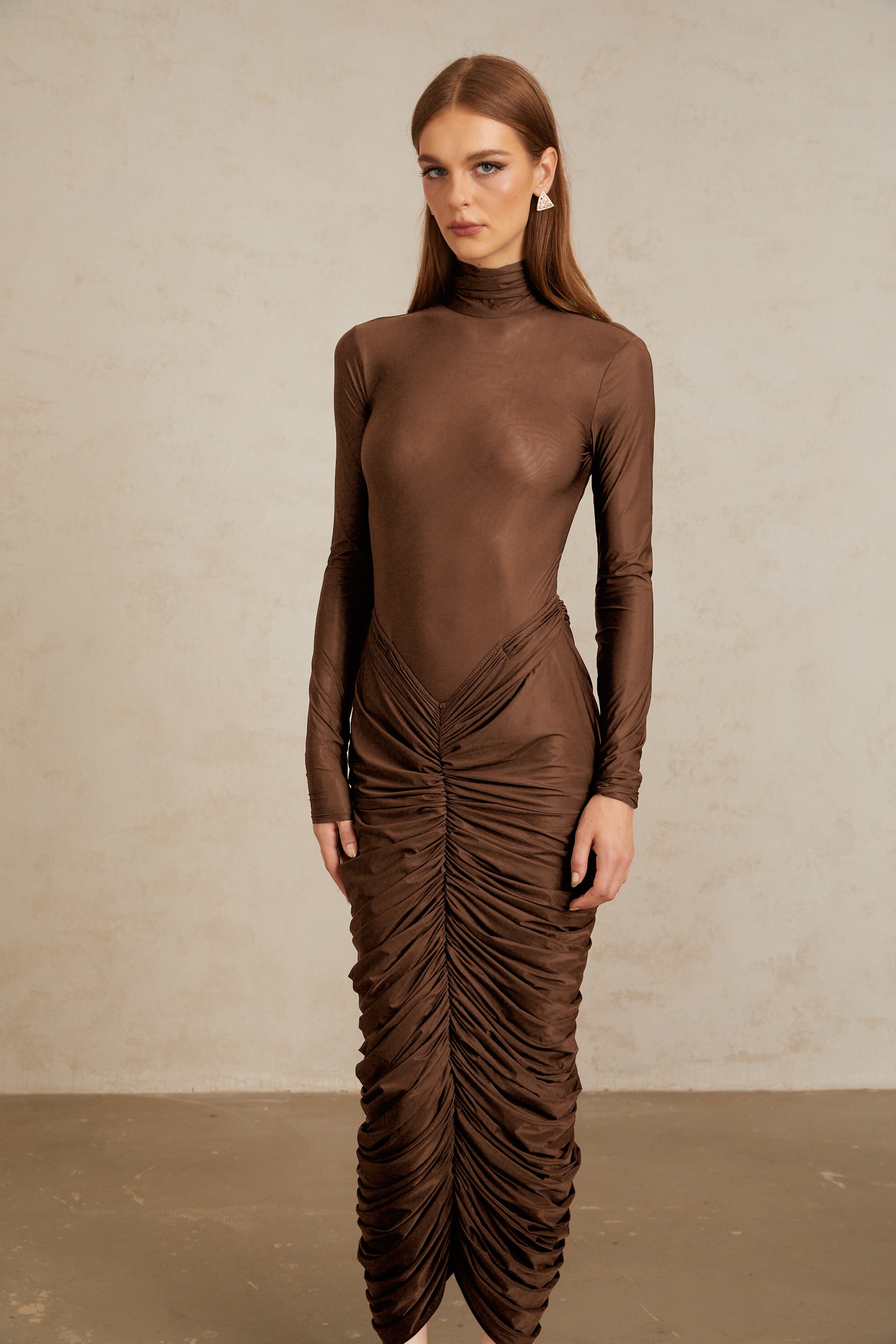 Brown turtleneck long-sleeved midi dress with a ruched skirt