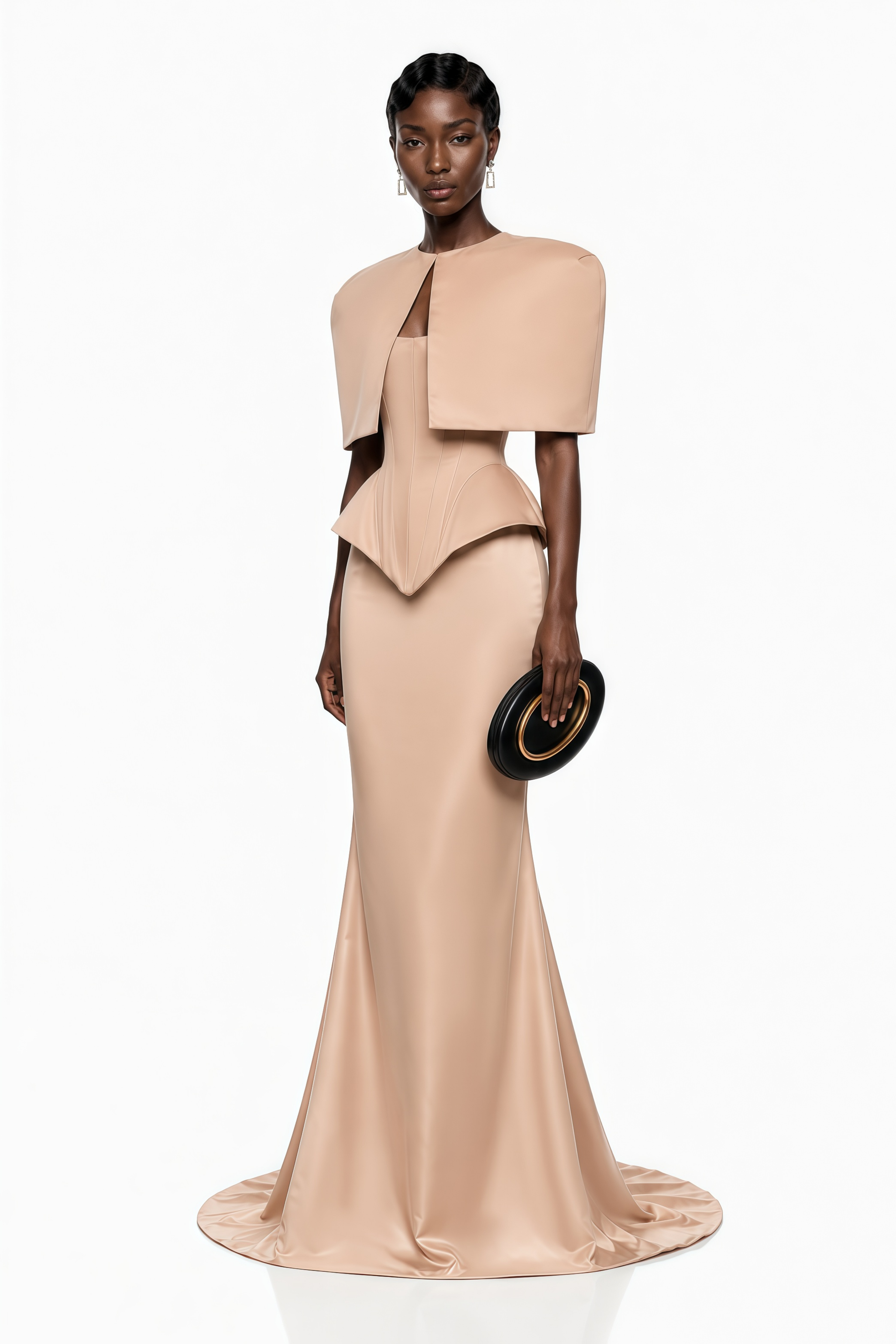 Nude beige satin mermaid gown featuring a structured corset bodice and a matching sculptural caped bolero