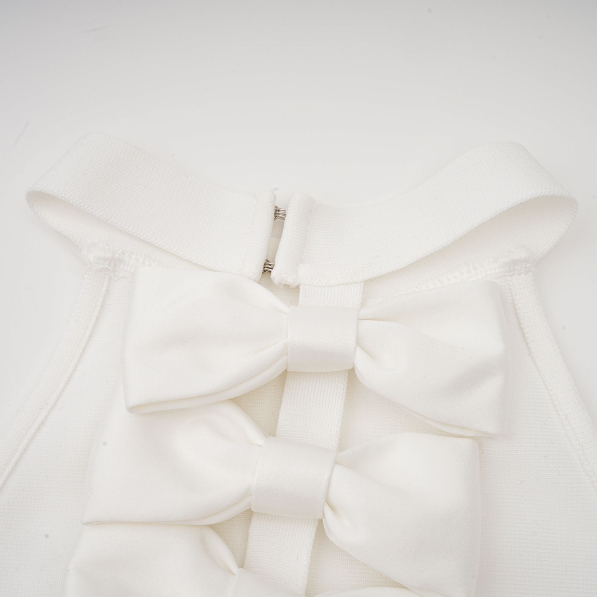 Capucine white oversize-bow bandage dress