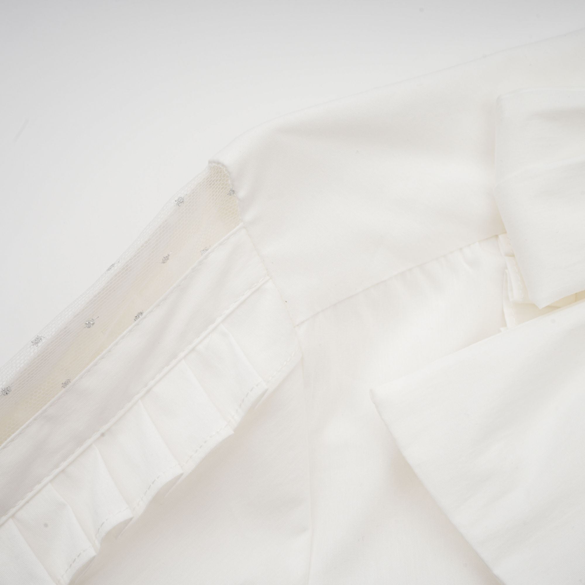 Céleste white pleated scarf-collar shirt