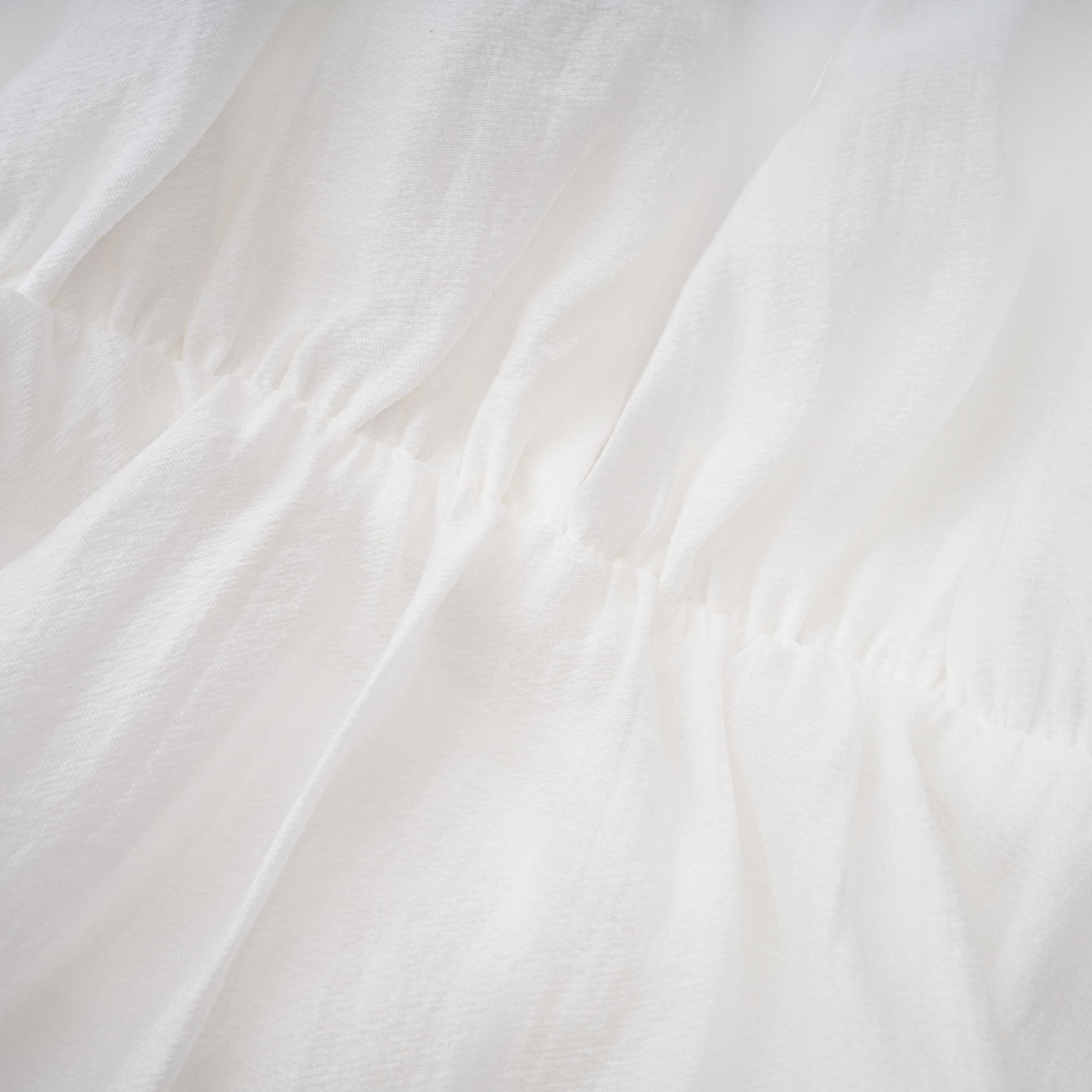 Quincie white shirred flounced mini dress