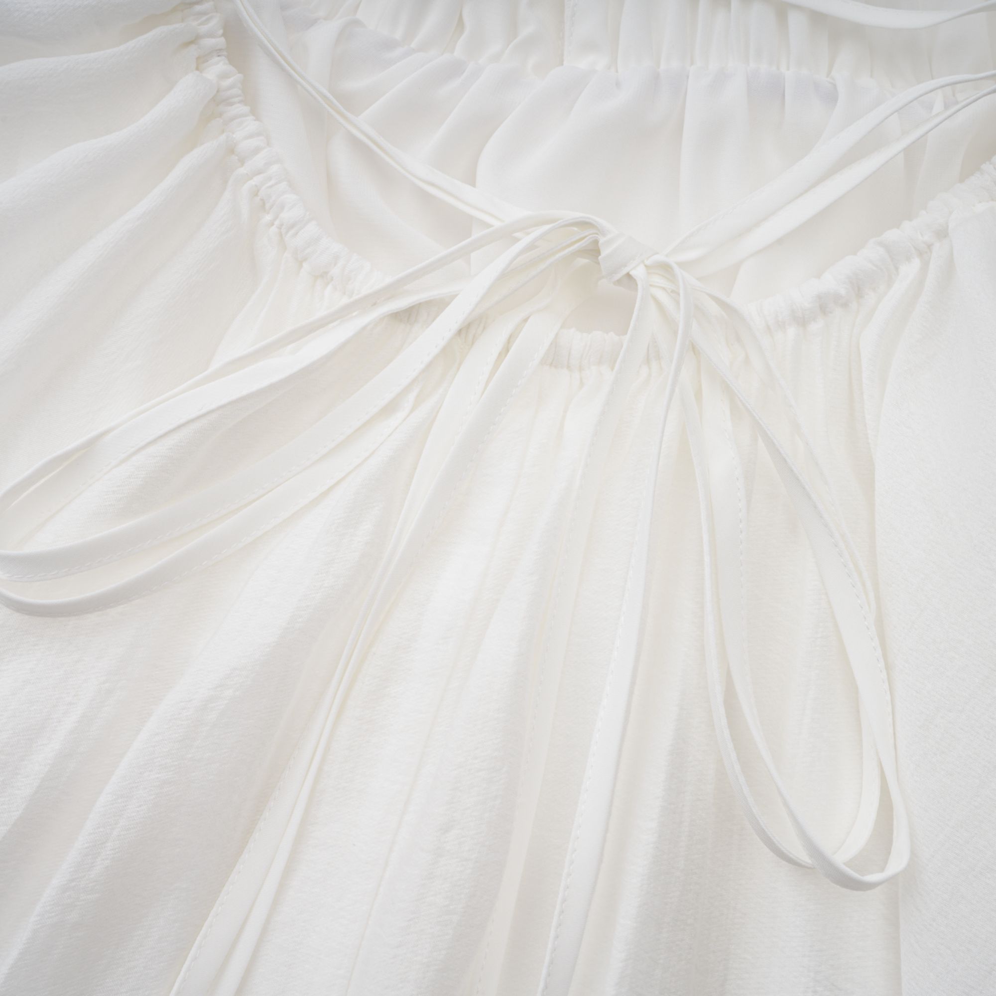 Quincie white shirred flounced mini dress