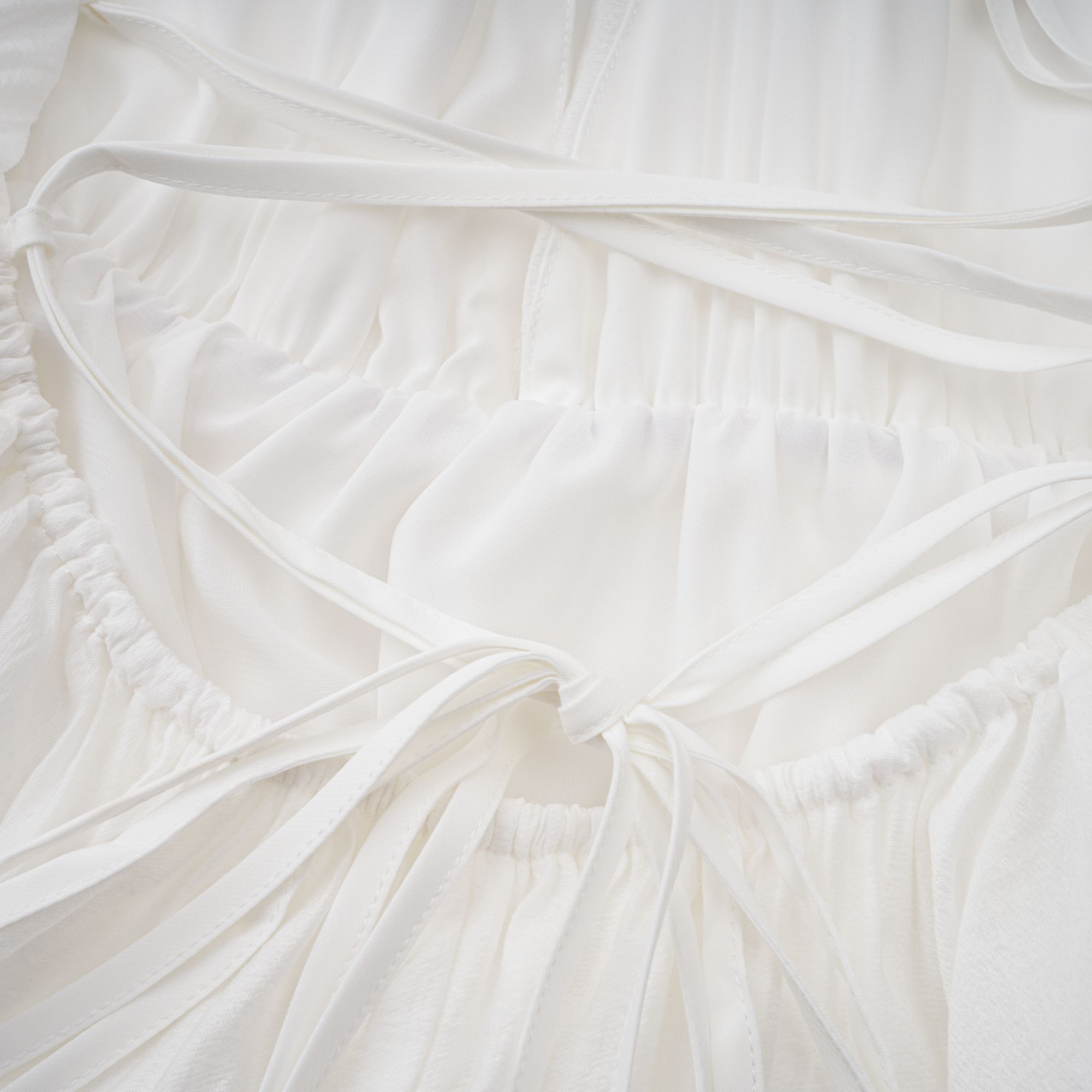 Quincie white shirred flounced mini dress