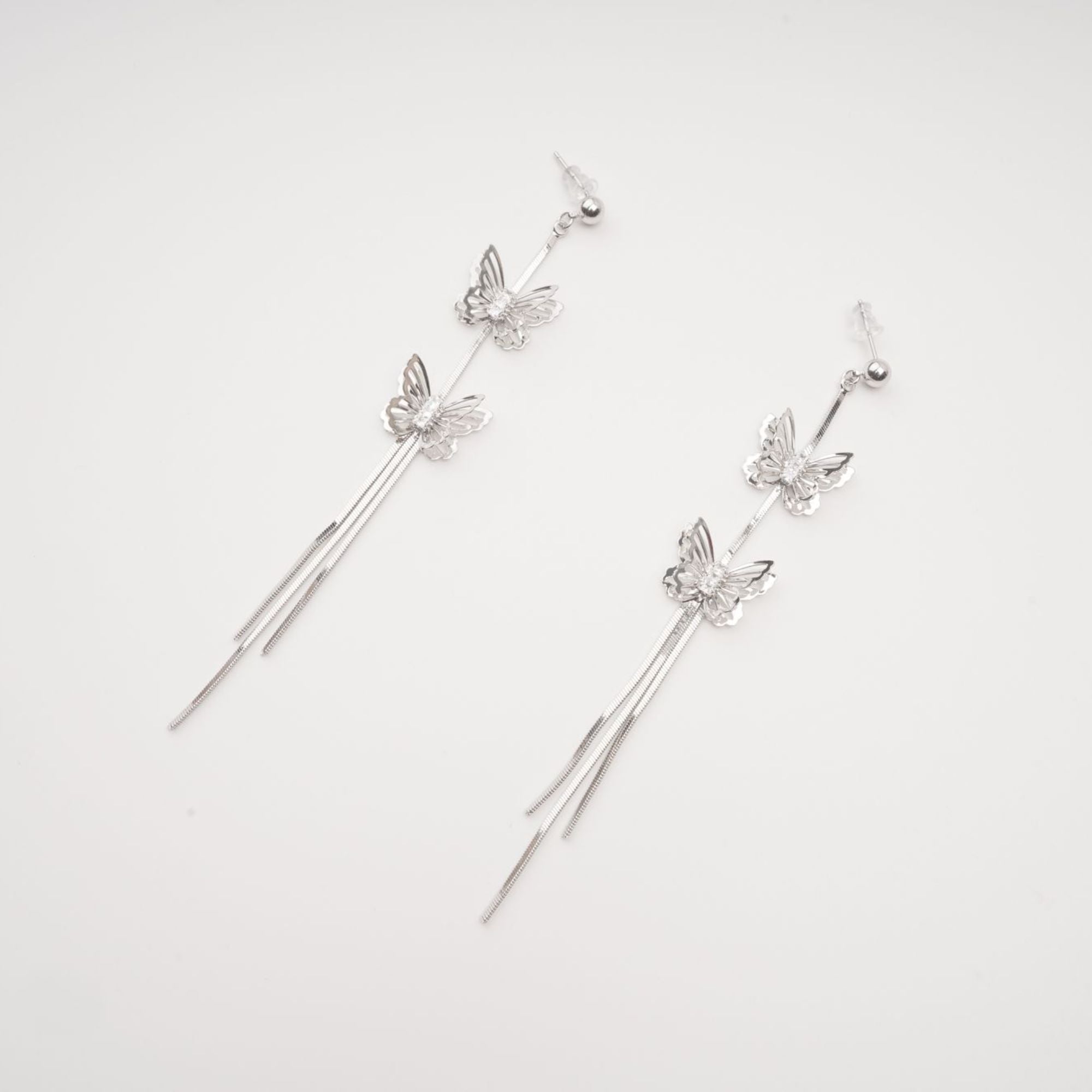 Bella silver butterfly drop earrings