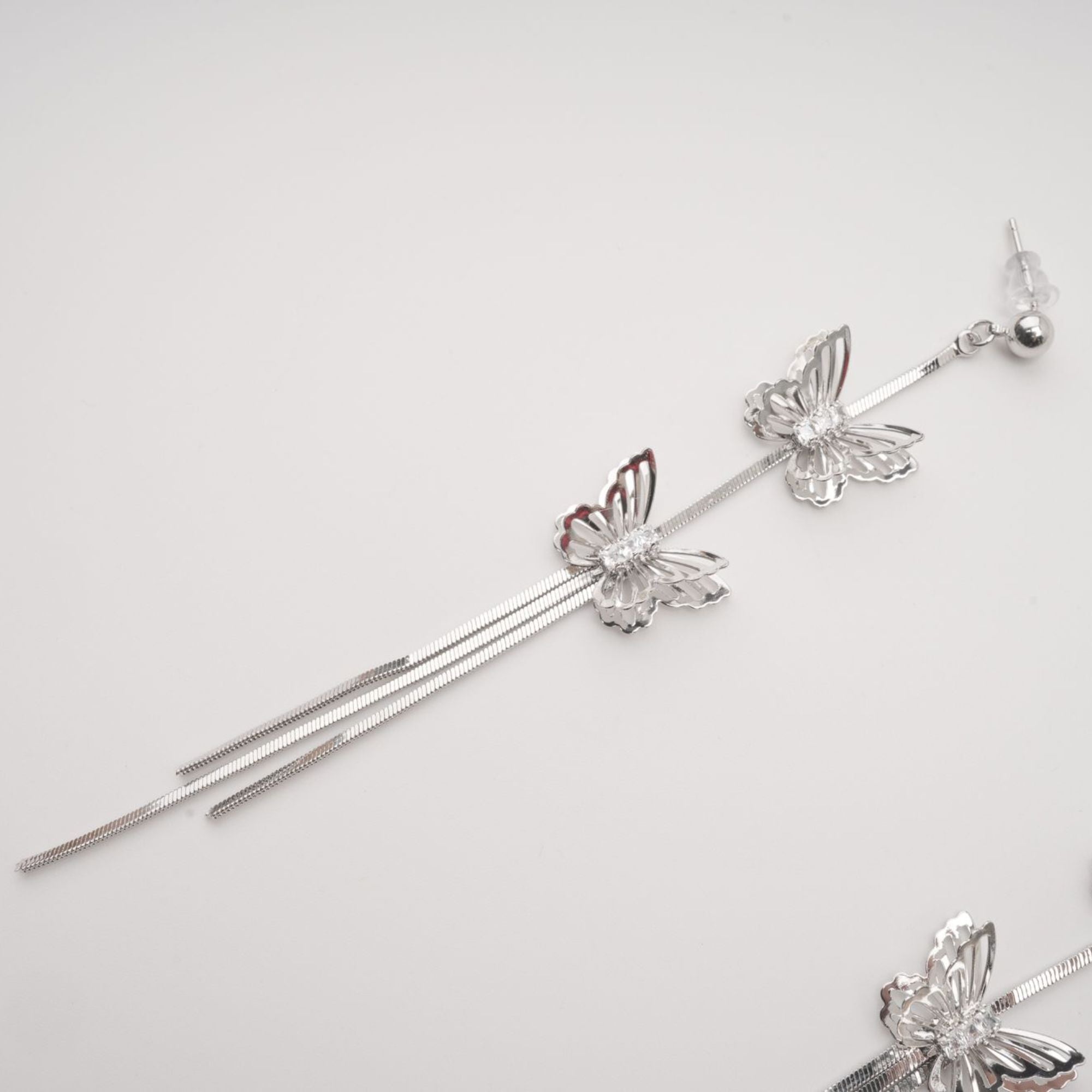 Bella silver butterfly drop earrings