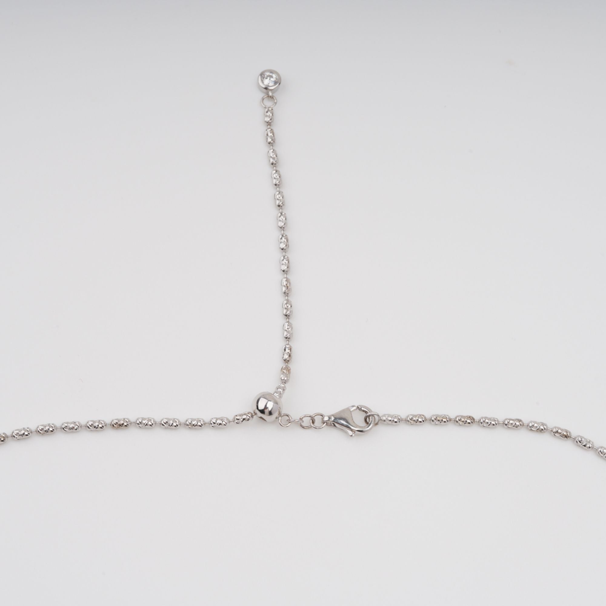 Tuulikki Halskette aus Sterlingsilber mit blauem, kreuzförmigem Edelsteinanhänger im Birnenschliff