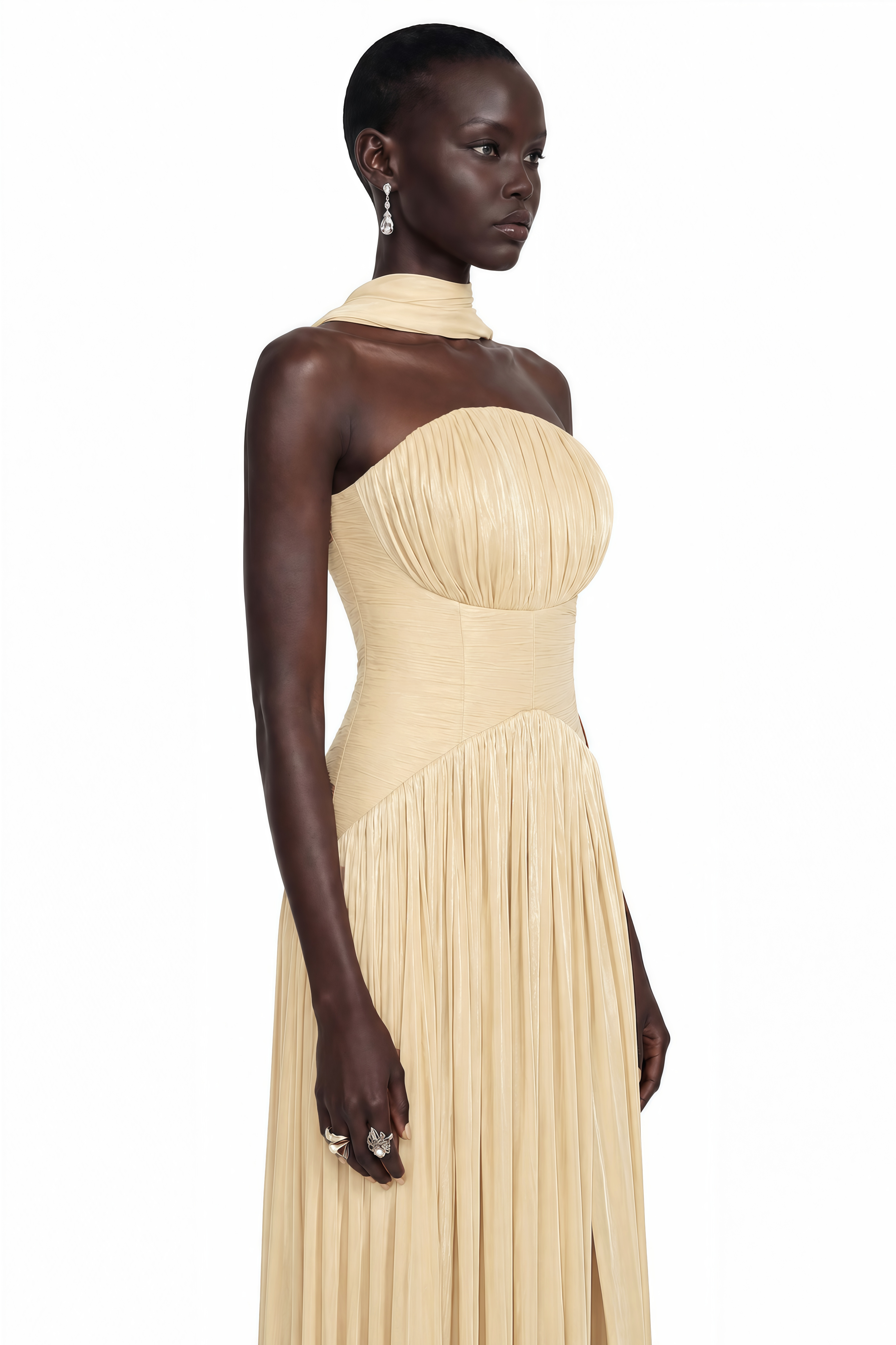 Champagne strapless pleated maxi dress with a high leg slit