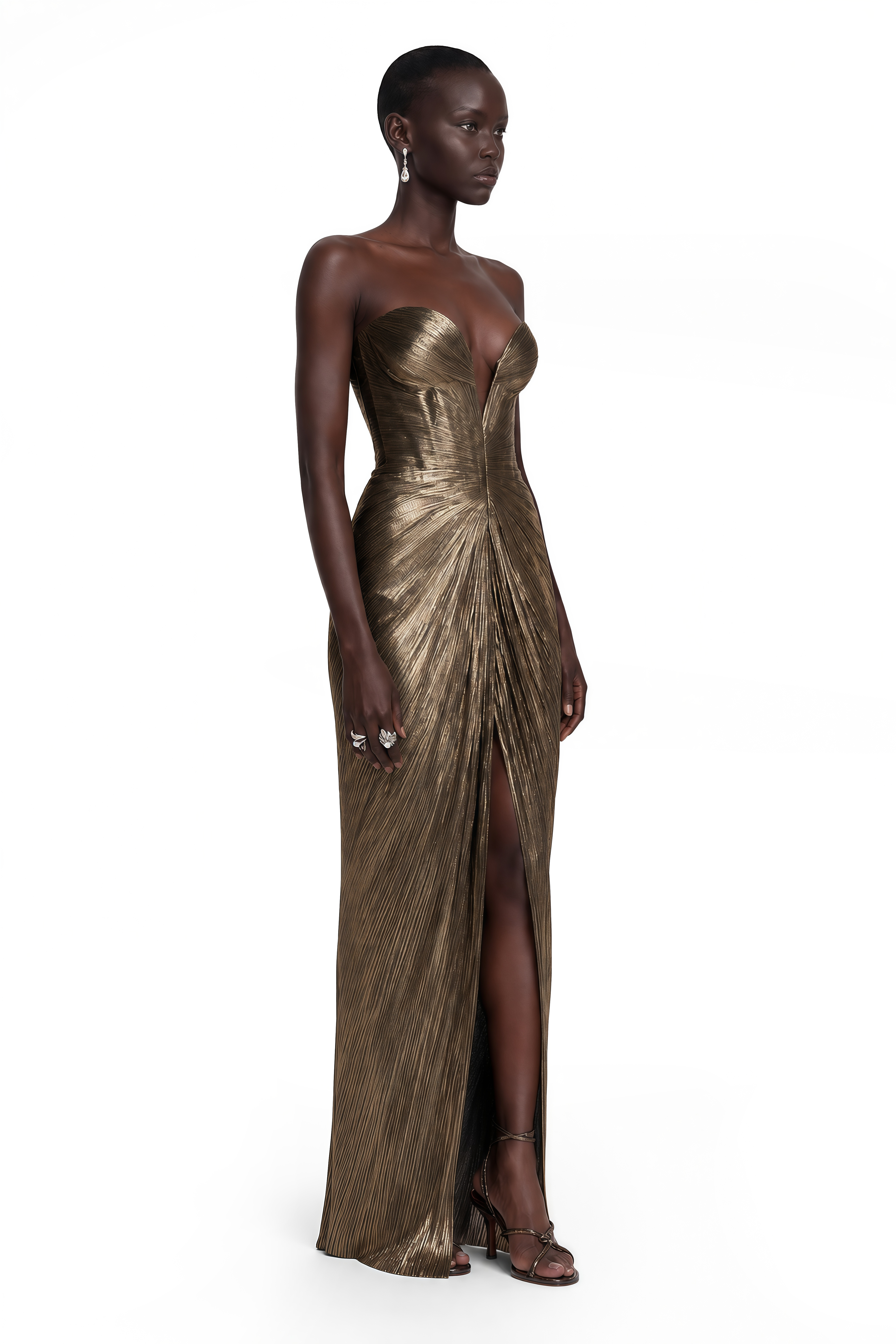 Antique gold strapless maxi dress with a plunging sweetheart neckline, pleated bodice, and a front leg slit